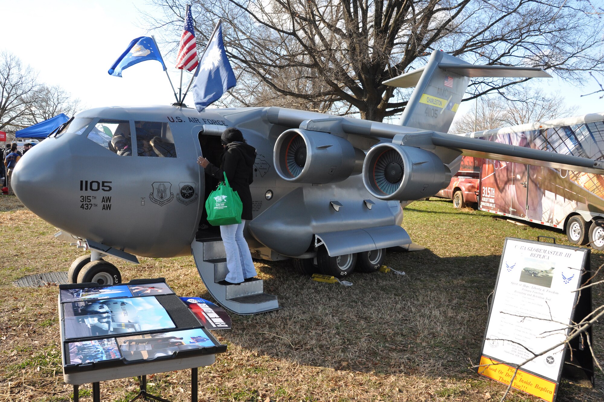 The mini C-17 and Reservists from the 315th Airlift Wing, Joint Base Charleston, S.C. showcase the miniature replica of a Boeing C-17 Globemaster III aircraft at the 2011 Military Bowl at Robert F. Kennedy Stadium Dec. 28, 2011 in Washington, D.C. (U.S. Air Force photo/Senior Airman Bobby Pilch)
