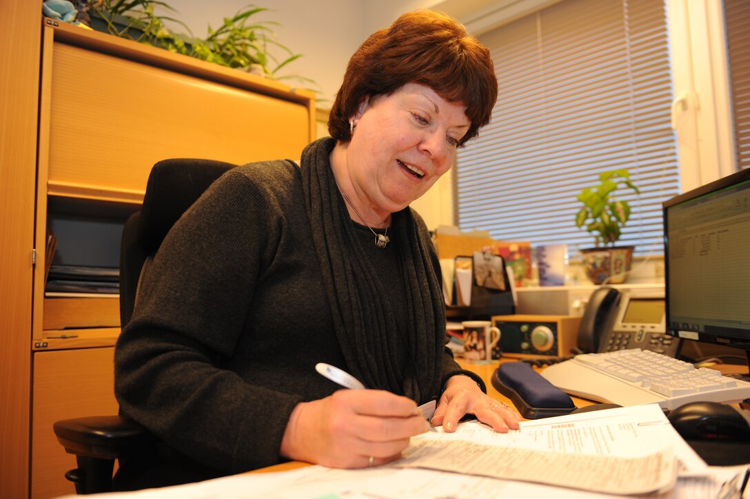 STAVANGER, Norway - Sue Svendsen goes over squadron finances Dec. 13. Svendsen is assigned to the 426th Air Base Squadron. (U.S. Air Force photo by Senior Airman Joel Mease)