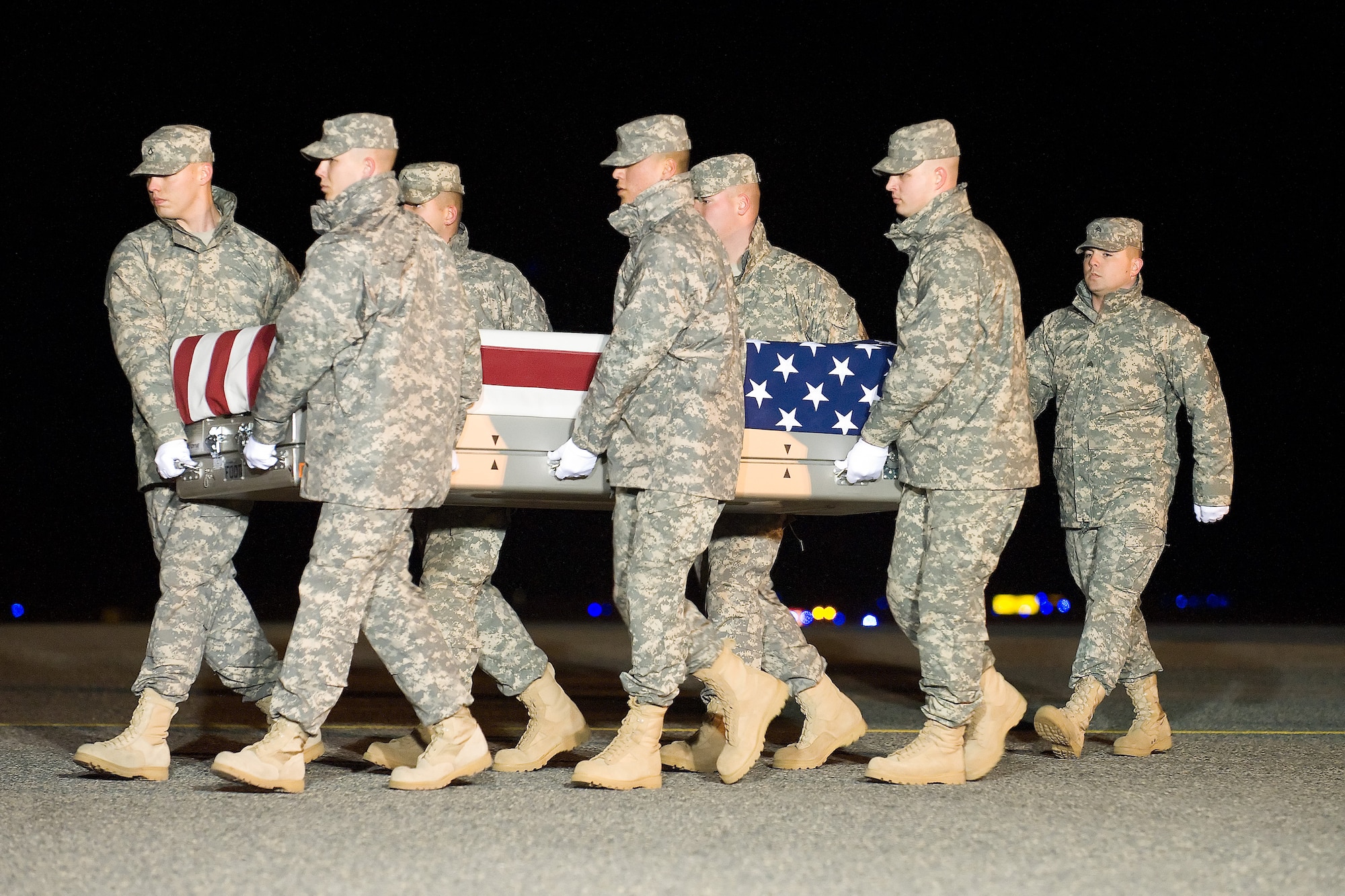 A U.S. Army carry team transfers the remains of Army Spc. Kurt W. Kern of McAllen, Texas, at Dover Air Force Base, Del., Dec. 29, 2011. Kern was assigned to the 720th Military Police Battalion, 89th Military Police Brigade, Fort Hood, Texas. (U.S. Air Force photo/Adrian R. Rowan)
