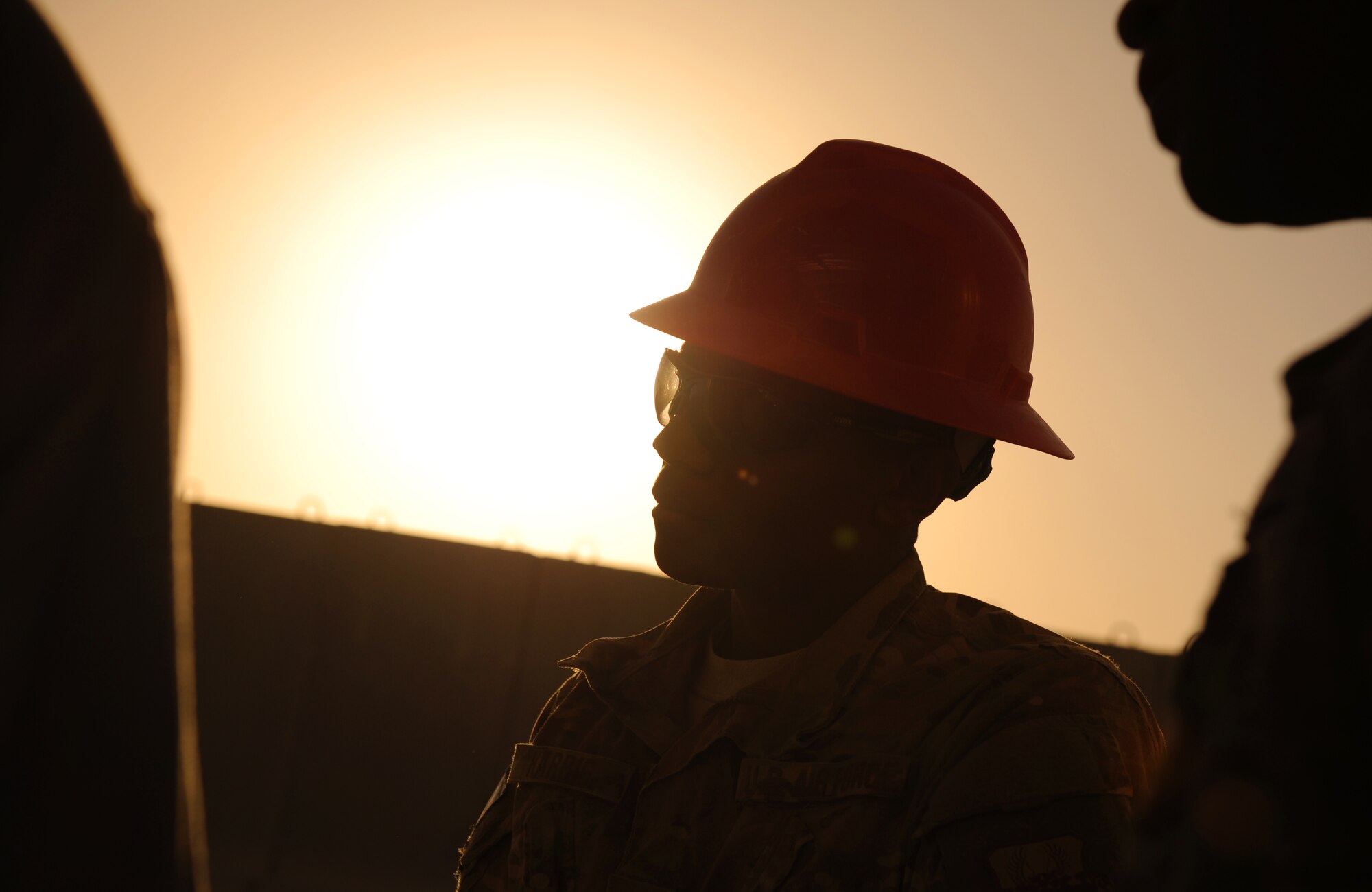 SOUTHWEST ASIA – Airman 1st Class Jerry Harris, 557th Expeditionary RED HORSE Squadron team member and native of La Grange, N.C., listens to a brief from his supervisor after working on a new RED HORSE facility here Dec. 28, 2011. The 9,000-square foot complex will house the 1st Expeditionary RED HORSE Group Headquarters, which oversees all Air Force construction operations throughout Southwest Asia. Harris is deployed from Seymour Johnson Air Force Base, N.C. RED HORSE stands for Rapid Engineer Deployable, Heavy Operations Repair Squadrons, Engineer. (U.S. Air Force photo/Staff Sgt. Nathanael Callon)