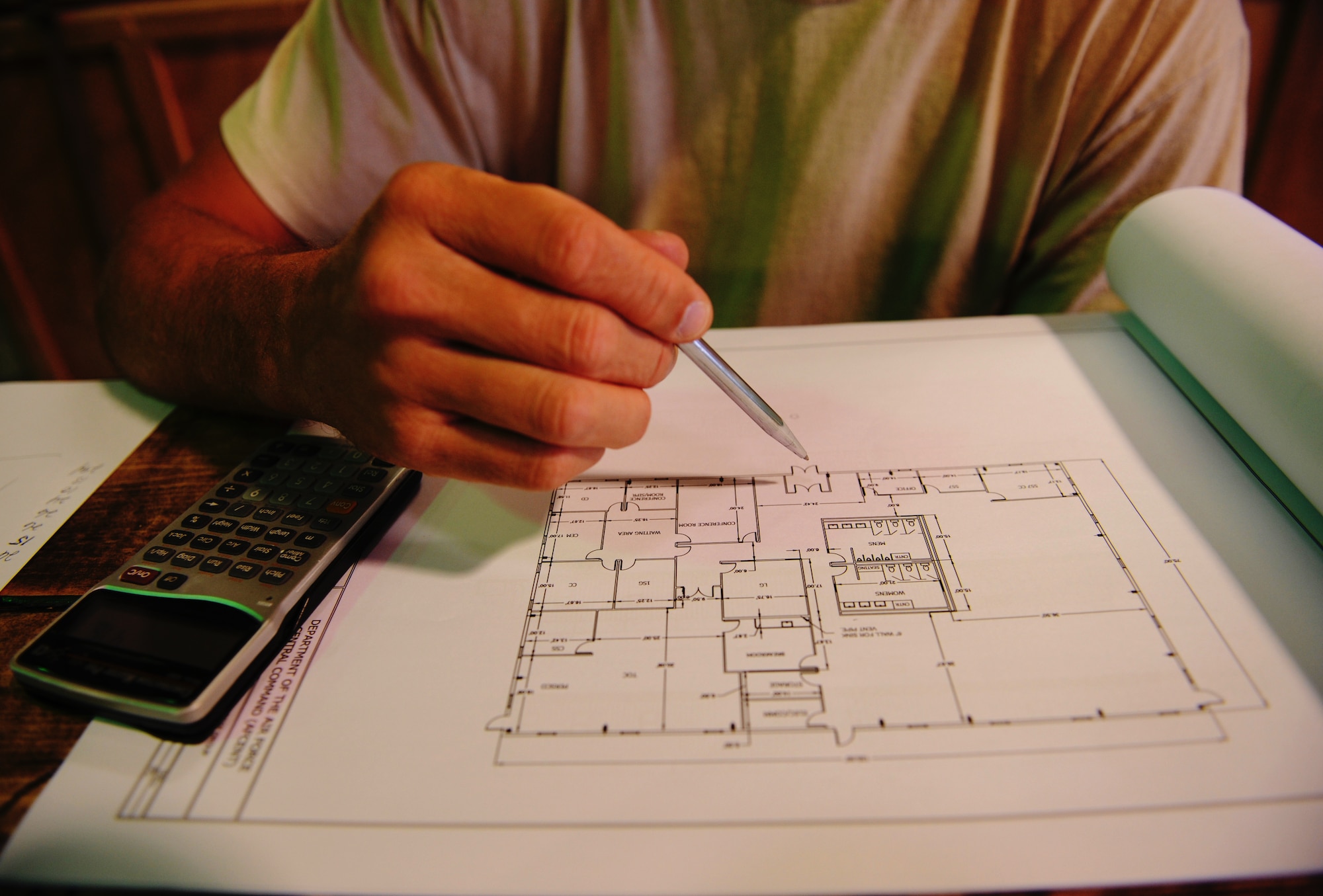 SOUTHWEST ASIA – Master Sgt. Christopher Belknap, 557th Expeditionary RED HORSE Squadron project manager and native of Rochester, N.Y., looks over the blueprints for a new RED HORSE facility here Dec. 27, 2011. The 9,000-square foot complex will house the 1st Expeditionary RED HORSE Group Headquarters. Belknap is deployed from Nellis Air Force Base, Nev. RED HORSE stands for Rapid Engineer Deployable, Heavy Operations Repair Squadrons, Engineer. (U.S. Air Force photo/Staff Sgt. Nathanael Callon)