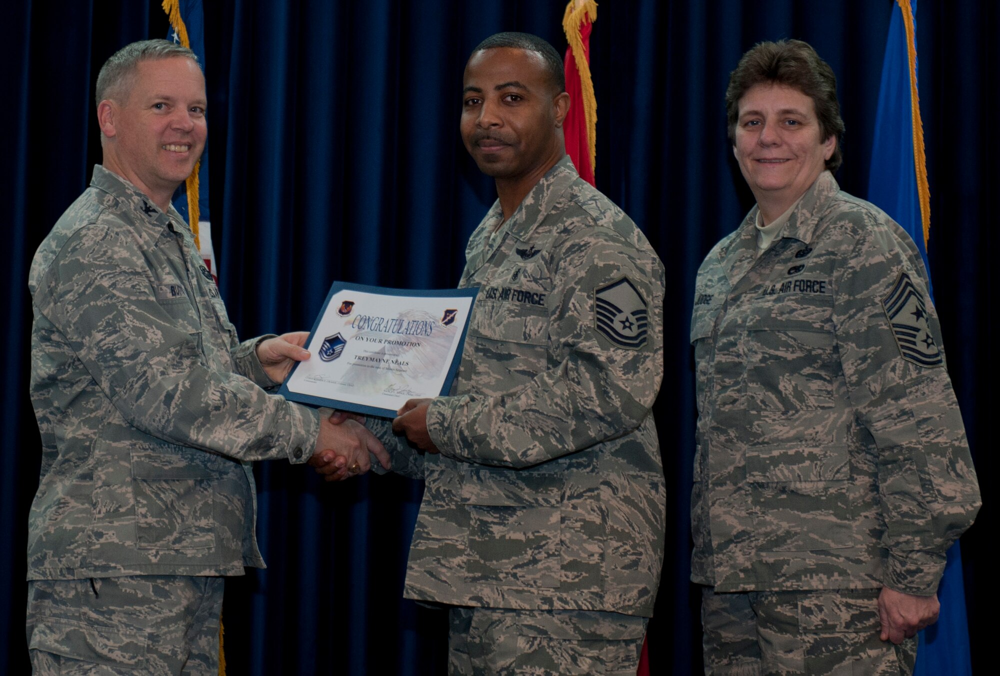 Treymayne Neals, 39th Medical Group, is promoted to the rank of master sergeant Dec. 29, 2011, in the Club Complex ballroom at Incirlik Air Base, Turkey. (U.S. Air Force photo by Senior Airman Anthony Sanchelli/Released)
