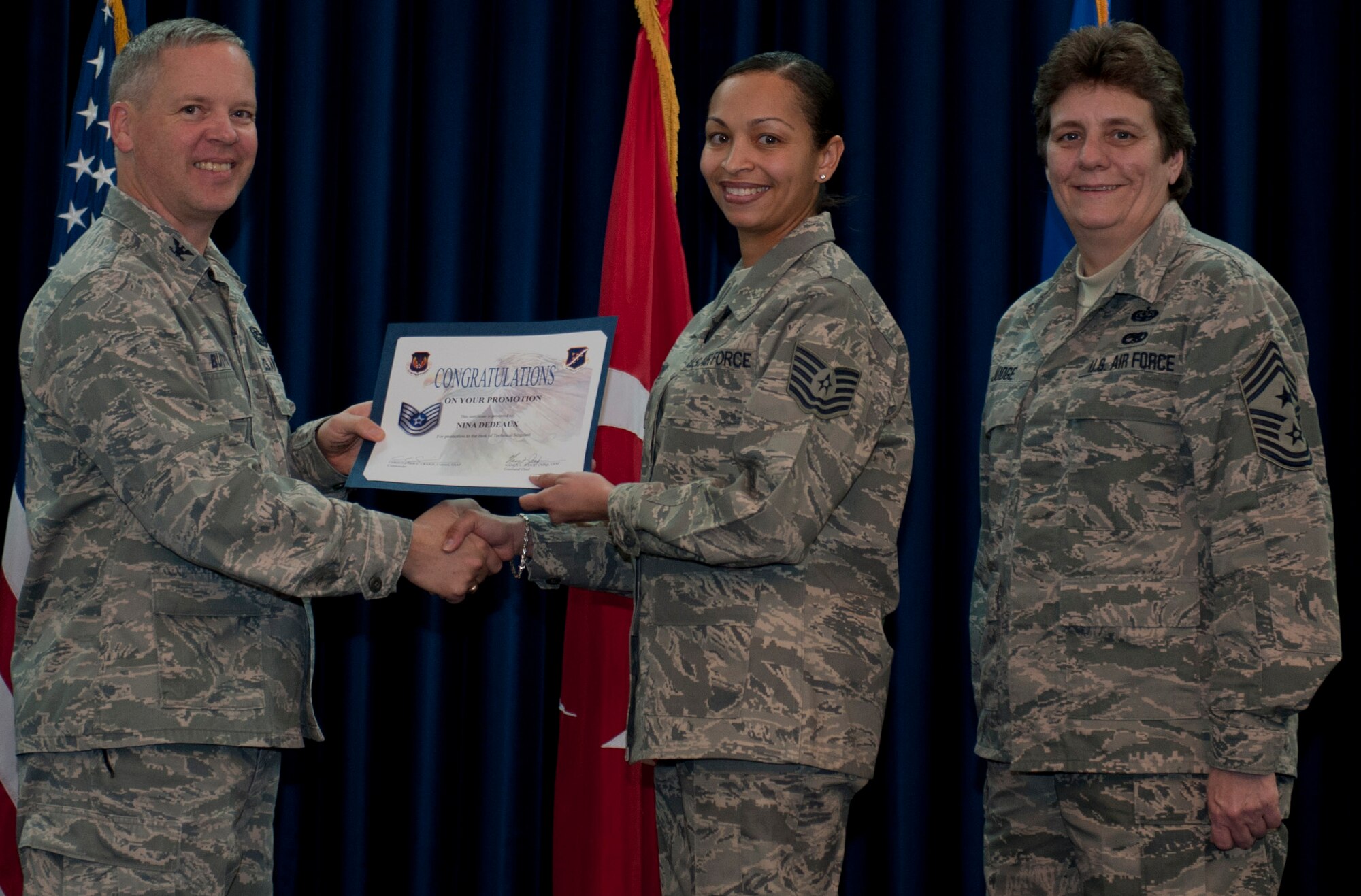 Nina Dedeaux, 39th Medical Support Squadron, is promoted to the rank of technical sergeant Dec. 29, 2011, in the Club Complex ballroom at Incirlik Air Base, Turkey. (U.S. Air Force photo by Senior Airman Anthony Sanchelli/Released)
