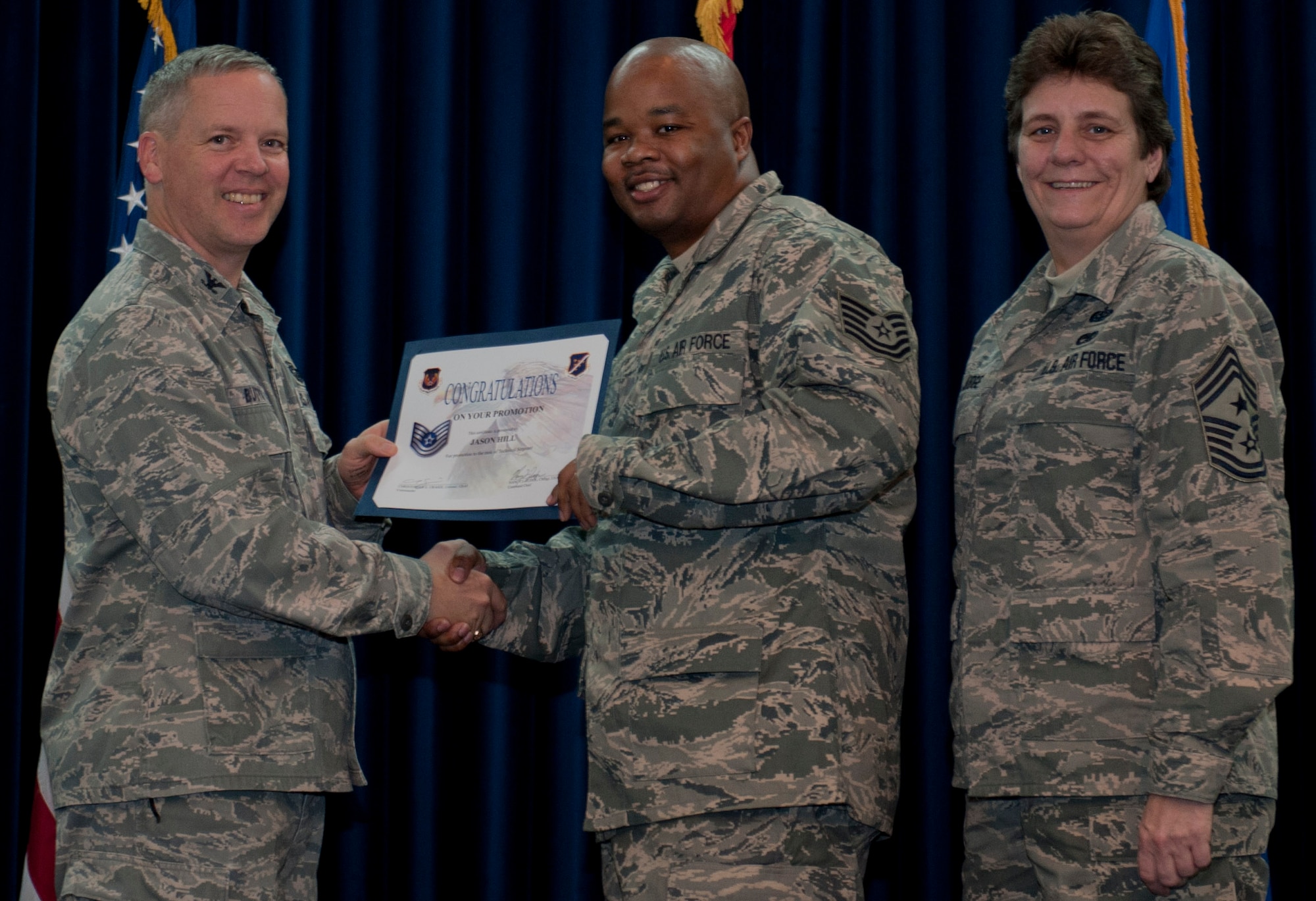 Jason Hill, 39th Logistics Readiness Squadron, is promoted to the rank of technical sergeant Dec. 29, 2011, in the Club Complex ballroom at Incirlik Air Base, Turkey. (U.S. Air Force photo by Senior Airman Anthony Sanchelli/Released)
