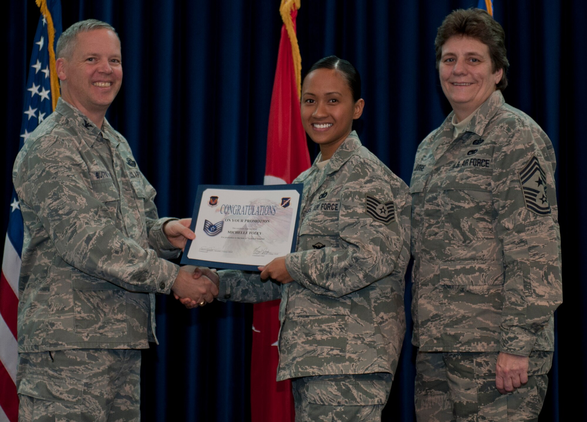 Michelle Foley, 39th Security Forces Squadron, is promoted to the rank of technical sergeant Dec. 29, 2011, in the Club Complex ballroom at Incirlik Air Base, Turkey. (U.S. Air Force photo by Senior Airman Anthony Sanchelli/Released)
