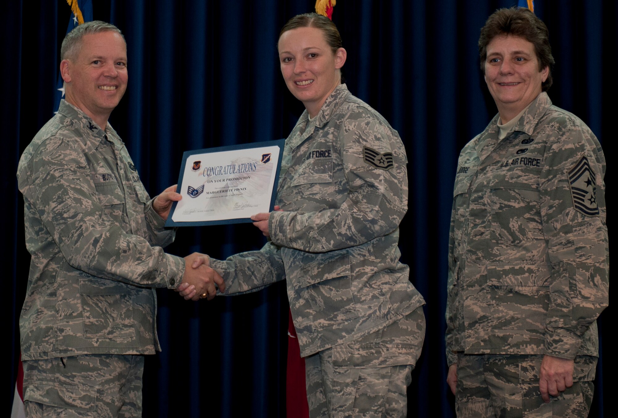 Margueriete Pinnix, 39th Medical Operations Squadron, is promoted to the rank of staff sergeant Dec. 29, 2011, in the Club Complex ballroom at Incirlik Air Base, Turkey. (U.S. Air Force photo by Senior Airman Anthony Sanchelli/Released)

