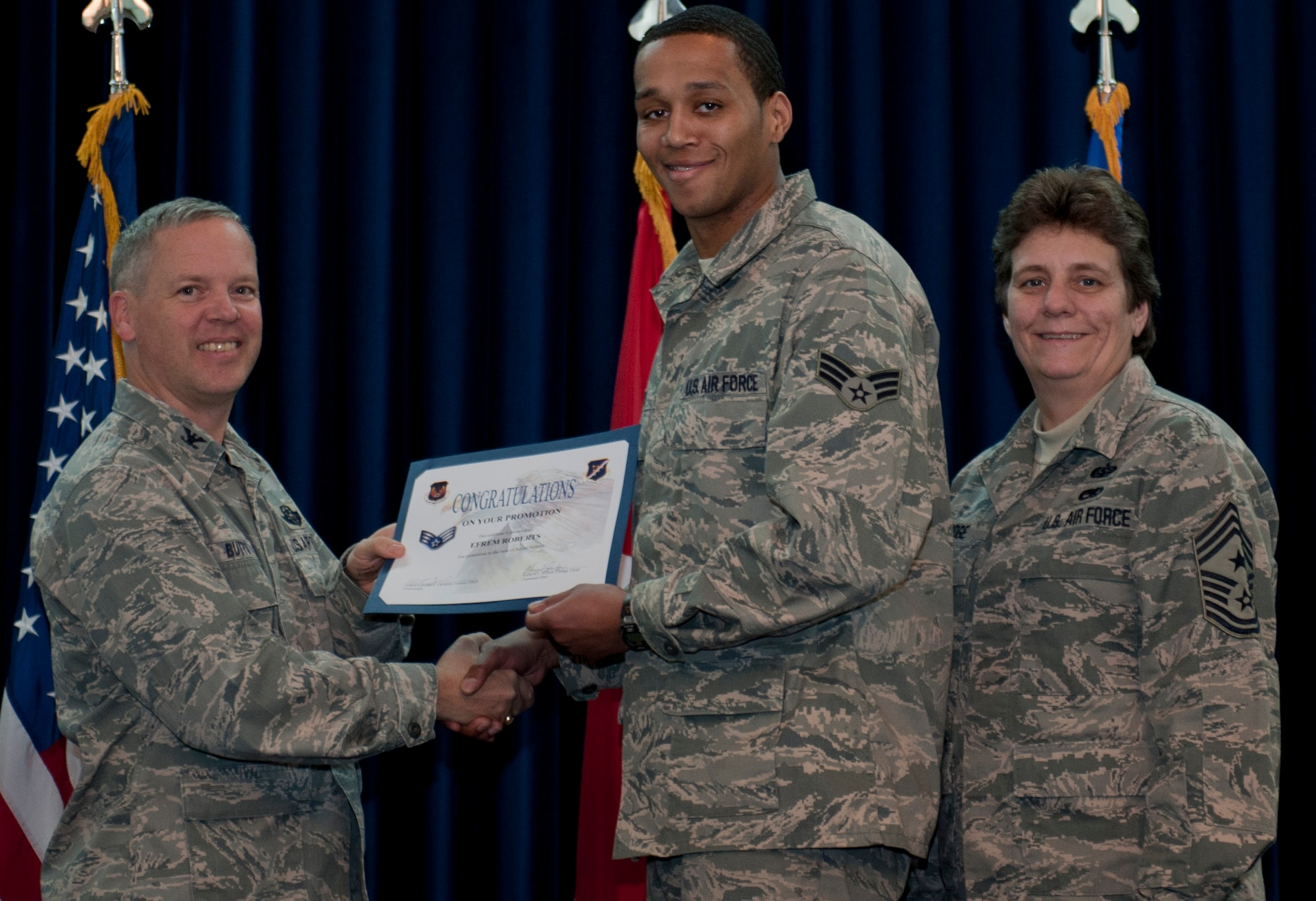 Robert Efrem, 728th Air Mobility Squadron, is promoted to the rank of senior airman Dec. 29, 2011, in the Club Complex ballroom at Incirlik Air Base, Turkey. (U.S. Air Force photo by Senior Airman Anthony Sanchelli/Released)
