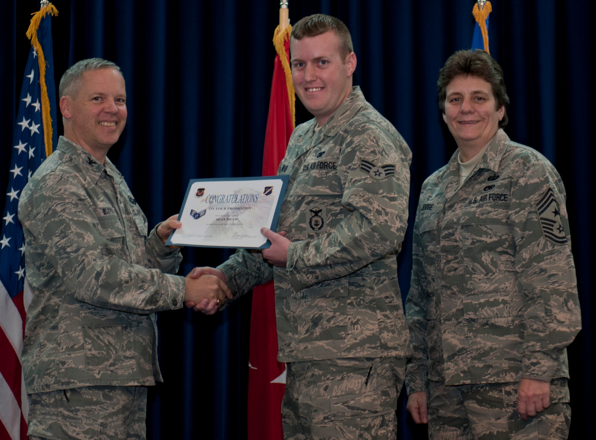 Sean Mead, 39th Security Forces Squadron, is promoted to the rank of senior airman Dec. 29, 2011, in the Club Complex ballroom at Incirlik Air Base, Turkey. (U.S. Air Force photo by Senior Airman Anthony Sanchelli/Released)
