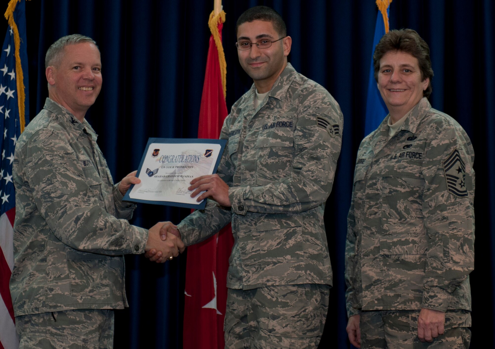Shahab Ghayournejadian, 39th Logistics Readiness Squadron, is promoted to the rank of senior airman Dec. 29, 2011, in the Club Complex ballroom at Incirlik Air Base, Turkey. (U.S. Air Force photo by Senior Airman Anthony Sanchelli/Released)
