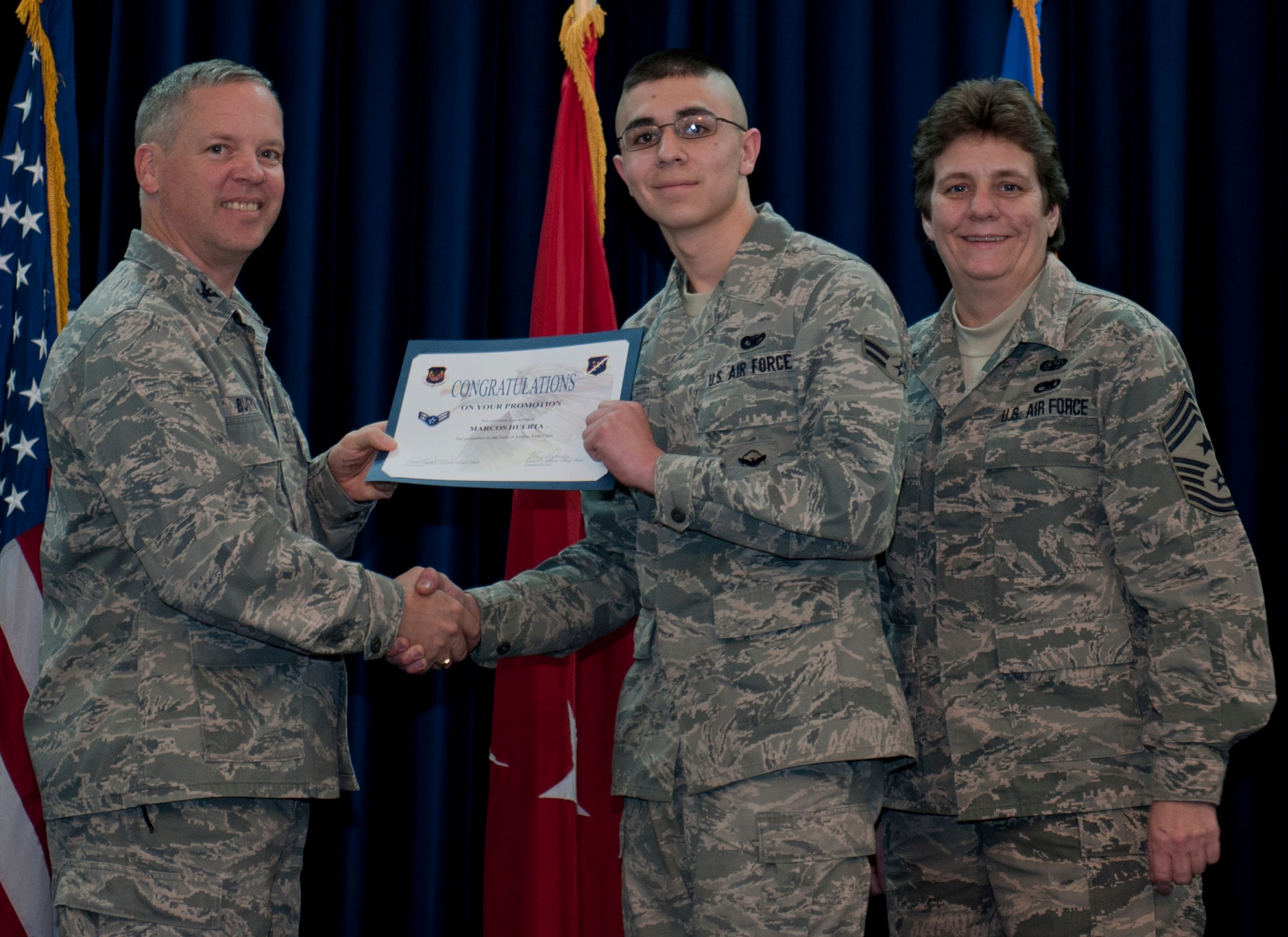 Marcos Huerta, 39th Security Forces Squadron, is promoted to the rank of airman first class Dec. 29, 2011, in the Club Complex ballroom at Incirlik Air Base, Turkey. (U.S. Air Force photo by Senior Airman Anthony Sanchelli/Released)
