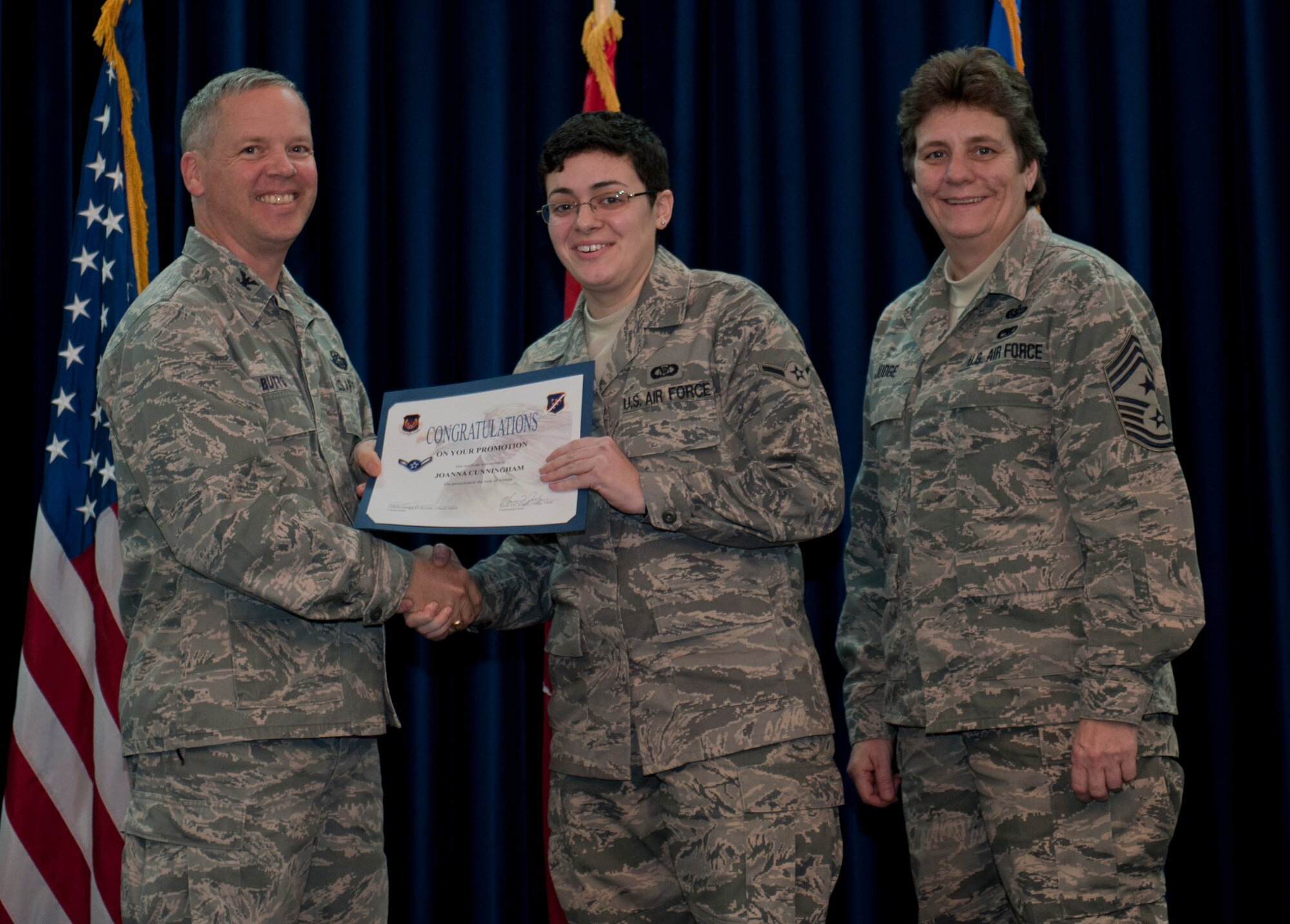 Joanna Cunningham, 39th Operations Squadron, is promoted to the rank of airman Dec. 29, 2011, in the Club Complex ballroom at Incirlik Air Base, Turkey. (U.S. Air Force photo by Senior Airman Anthony Sanchelli/Released)
