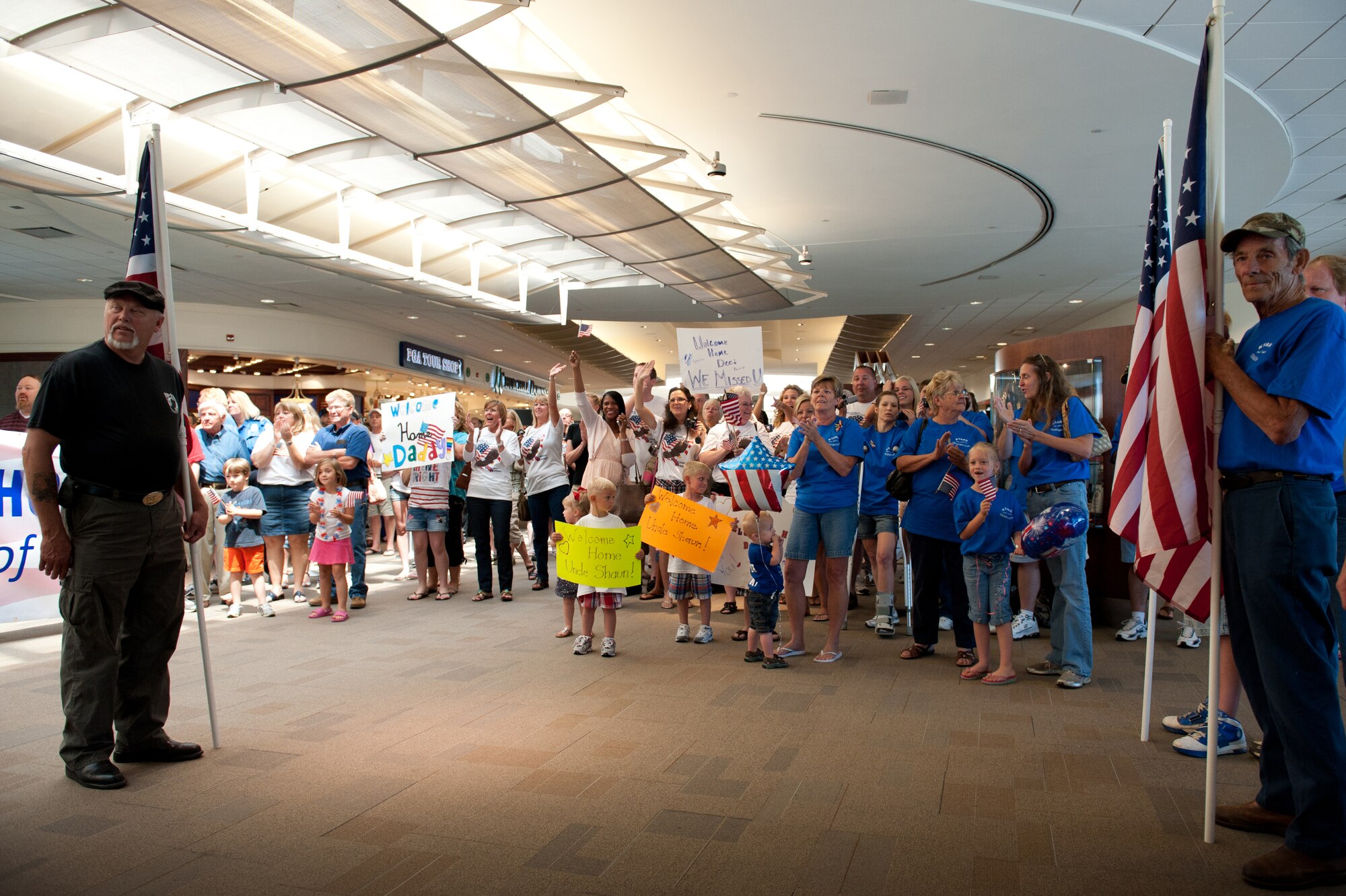 Friends and family of more than a dozen Kentucky Air National Guardsmen greet the troops at Louisville International Airport in Louisville, Ky., as they return from a six-month deployment to Afghanistan on June 25, 2011. The Airmen are the first of more than 40 members of the Kentucky Air Guard's 123rd Civil Engineering Squadron who will be returning from Bagram Airfield, Afghanistan, through July. The Kentucky Airmen comprised approximately 60 percent of Bagram's 455th Expeditionary Civil Engineer Squadron during the deployment in support of Operation Enduring Freedom, managing maintenance and construction for the 1,000-acre base and its 11,000-foot runway. The squadron completed over 60 construction projects worth more than $300 million during the past six months, including a new C-130 aircraft hangar, a 1,500-foot road and base housing for 500 personnel. (U.S. Air Force photo by Maj. Dale Greer)