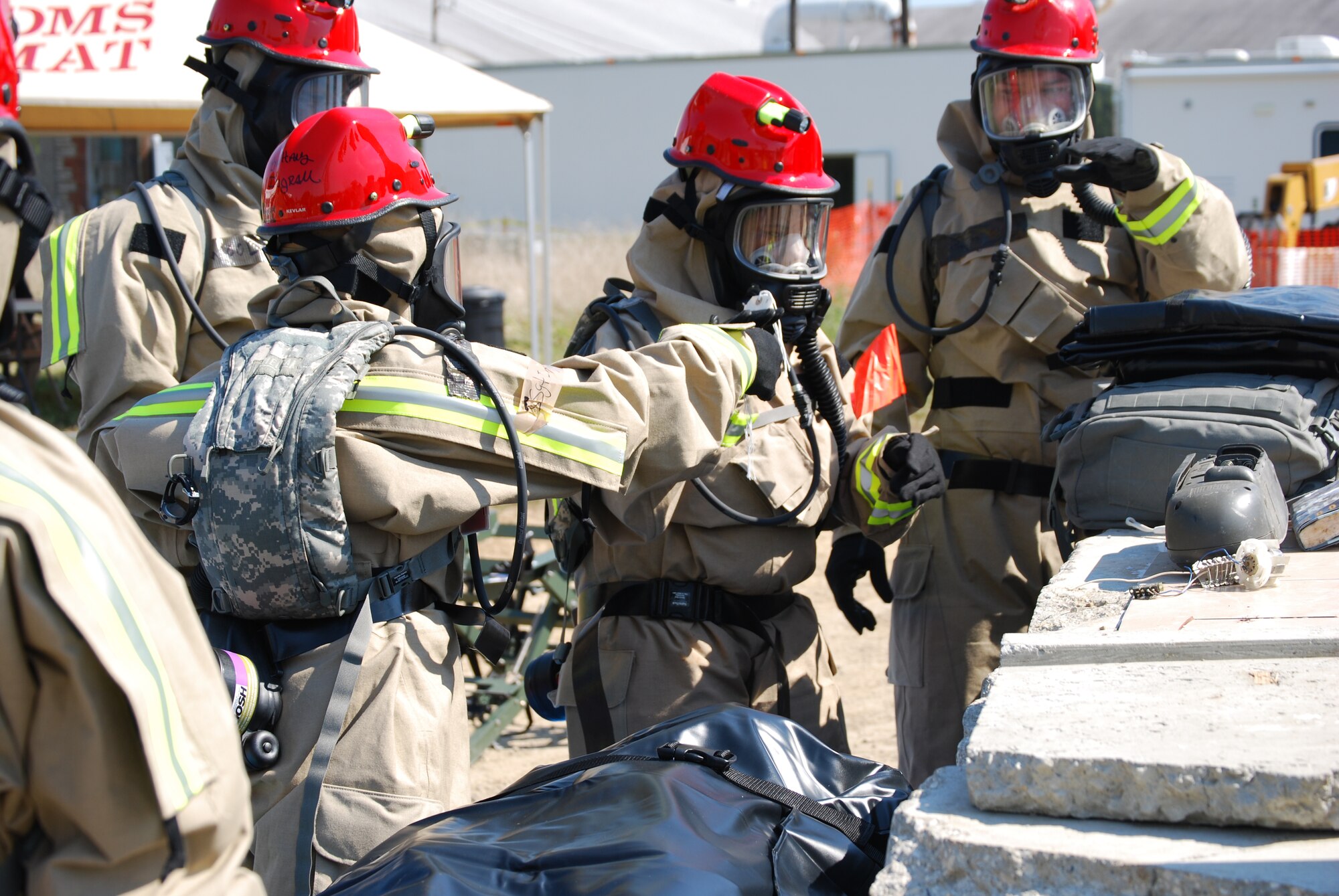 Protective gear allows Fatality Search and Recovery Team members from the Kentucky Air Guard's 123rd Airlift Wing to operate in a spectrum of dangerous environments, including those contaminated with nuclear or biological agents. The group was participating in Vibrant Response 12 at Camp Atterbury, Ind., on Aug. 18, 2011, to hone team members' ability to respond to a catastrophic chemical, biological, radiological or nuclear incidents in the homeland. (Courtesy photo)