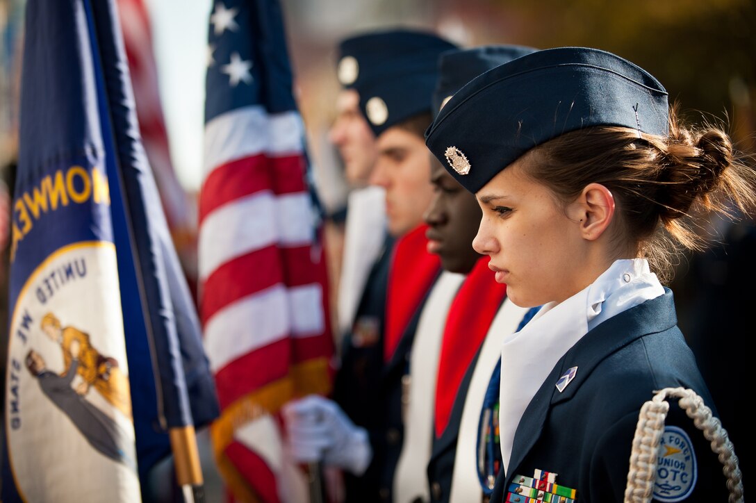 Cadet 2nd Lt. Ashley Brainer, a member of the Moore Traditional High School Air Force Junior JROTC detachment, stands at attention during the Massing of the Colors ceremony held Nov. 11, 2011, in downtown Louisville, Ky. The ceremony showcased dozens of color guard details from every branch of the U.S. military, numerous veterans' groups and a variety of government agencies like the Louisville Metro Fire Department. (U.S. Air Force photo by Maj. Dale Greer)