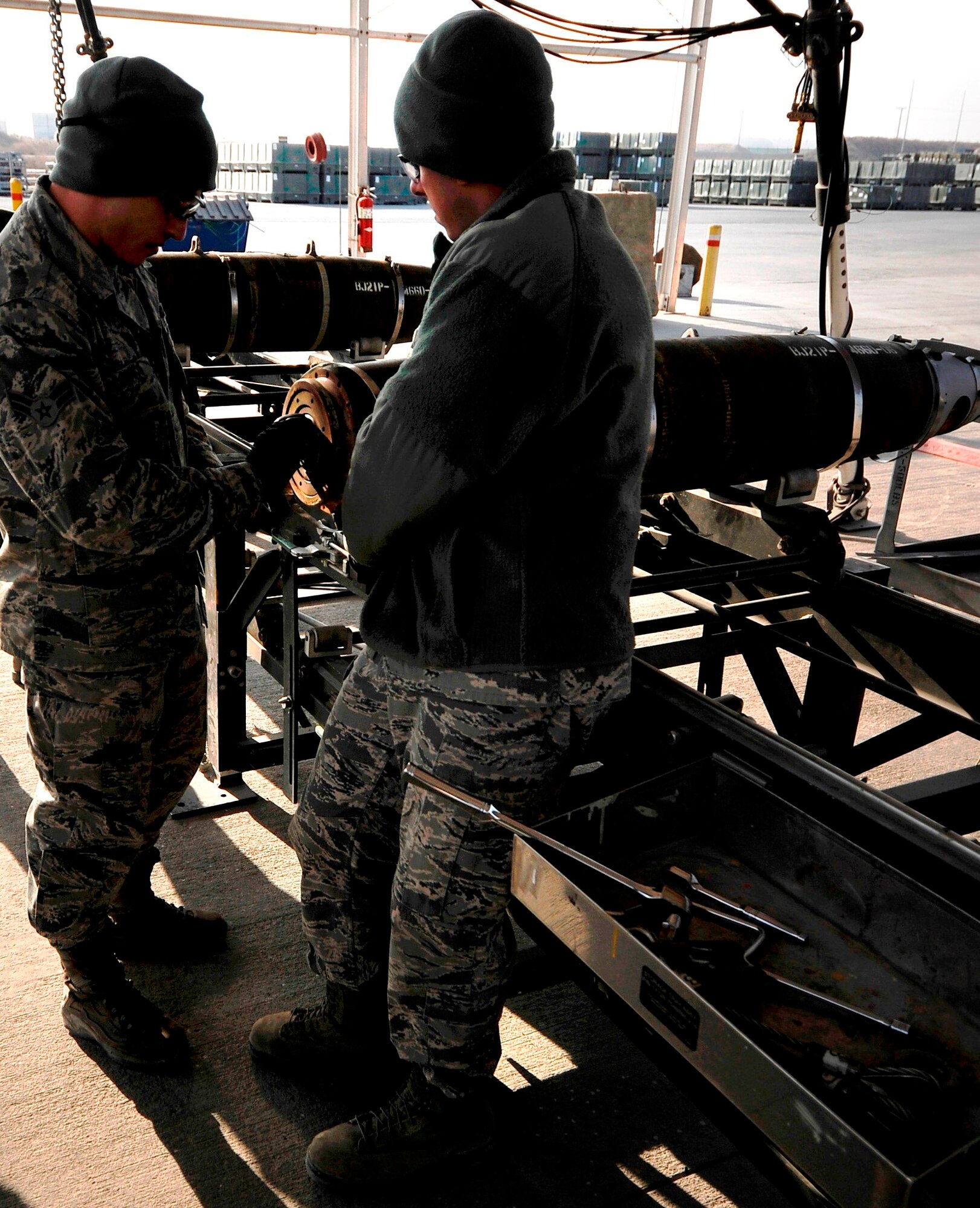 Airman 1st Class Joe LaGreca (left) inspects the components of an MK 82 bomb body during an assembled munitions serviceability inspection at Bagram Airfield, Afghanistan, Dec. 28, 2011.  The AMSI is performed twice a year to ensure the proper function of munitions stored at Bagram.  LaGreca is a munitions systems specialist deployed from the Air National Guard in Atlantic City, N.J.  (U.S. Air Force photo/Tech. Sgt. Vernon Cunningham)