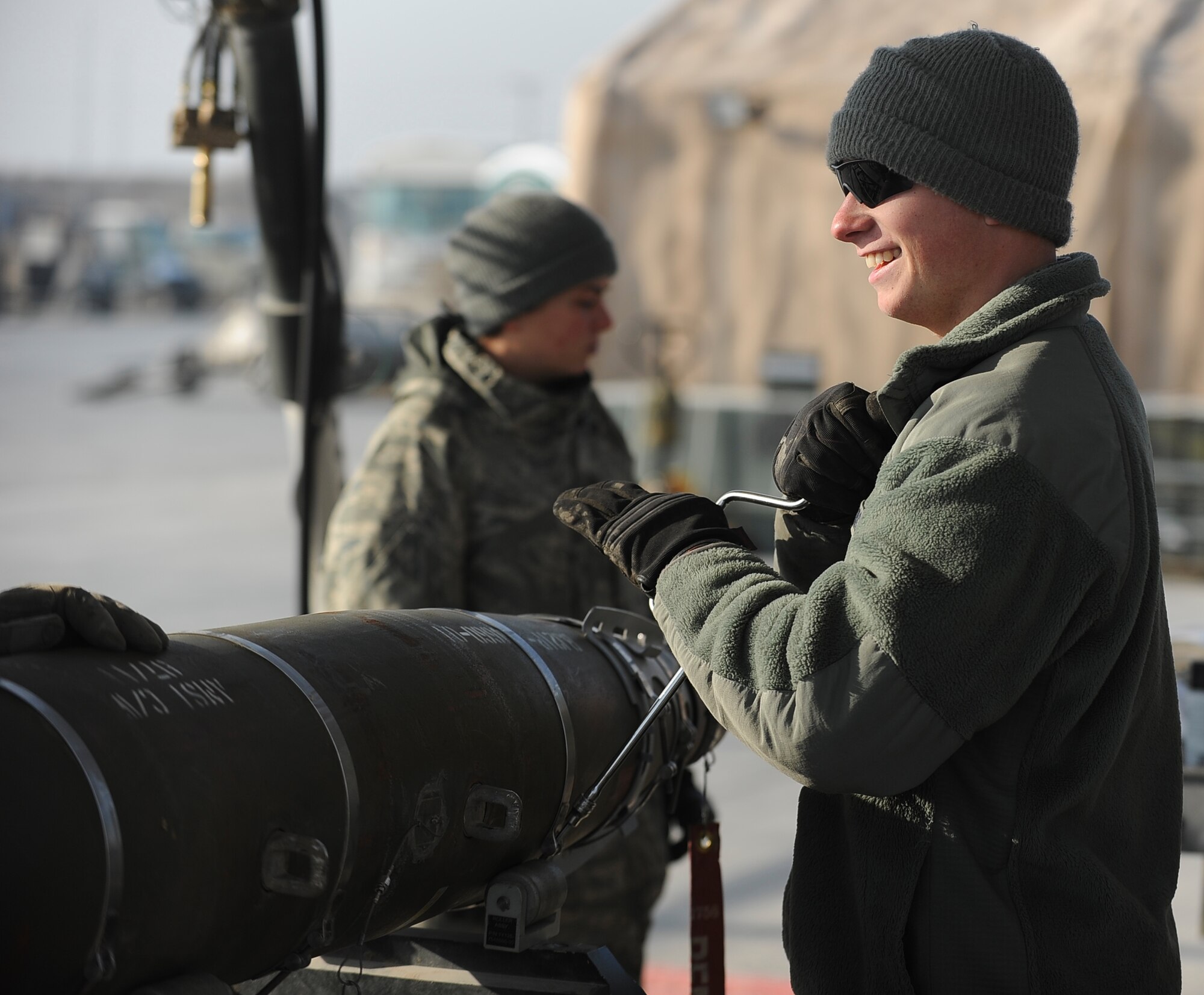 Airman 1st Class Zachary Coleman disassembles an MK-82 bomb body in preparation for the assembled munitions serviceability inspection at Bagram Airfield, Afghanistan, Dec. 28, 2011.  The 455th Expeditionary Maintenance Squadron Ammo shop inspected in-stock munitions every six months to ensure they were functional when needed.  Coleman is deployed here from Seymour Johnson Air Force Base, N.C., and is a munitions systems specialist with the 455th EMXS.  (U.S. Air Force photo/Tech. Sgt. Vernon Cunningham)
