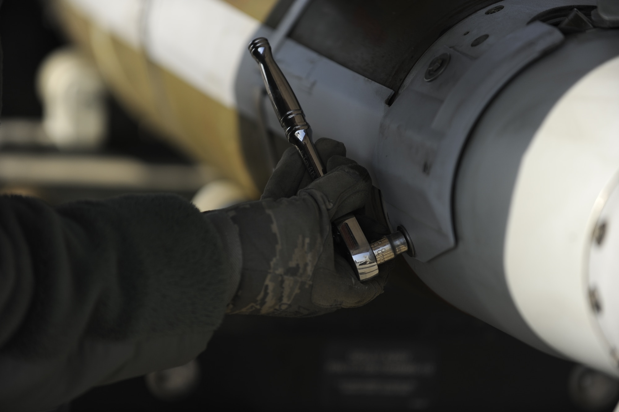 Airmen from the 455th Expeditionary Maintenance Squadron disassemble an MK-82 bomb body to perform their semi- annual assembled munitions serviceability inspection at Bagram Airfield, Afghanistan, Dec. 28, 2011.  Ammo Airmen checked every component to ensure the bomb was still functional and remained a valuable war asset when needed.  (U.S. Air Force photo/Tech. Sgt. Vernon Cunningham)