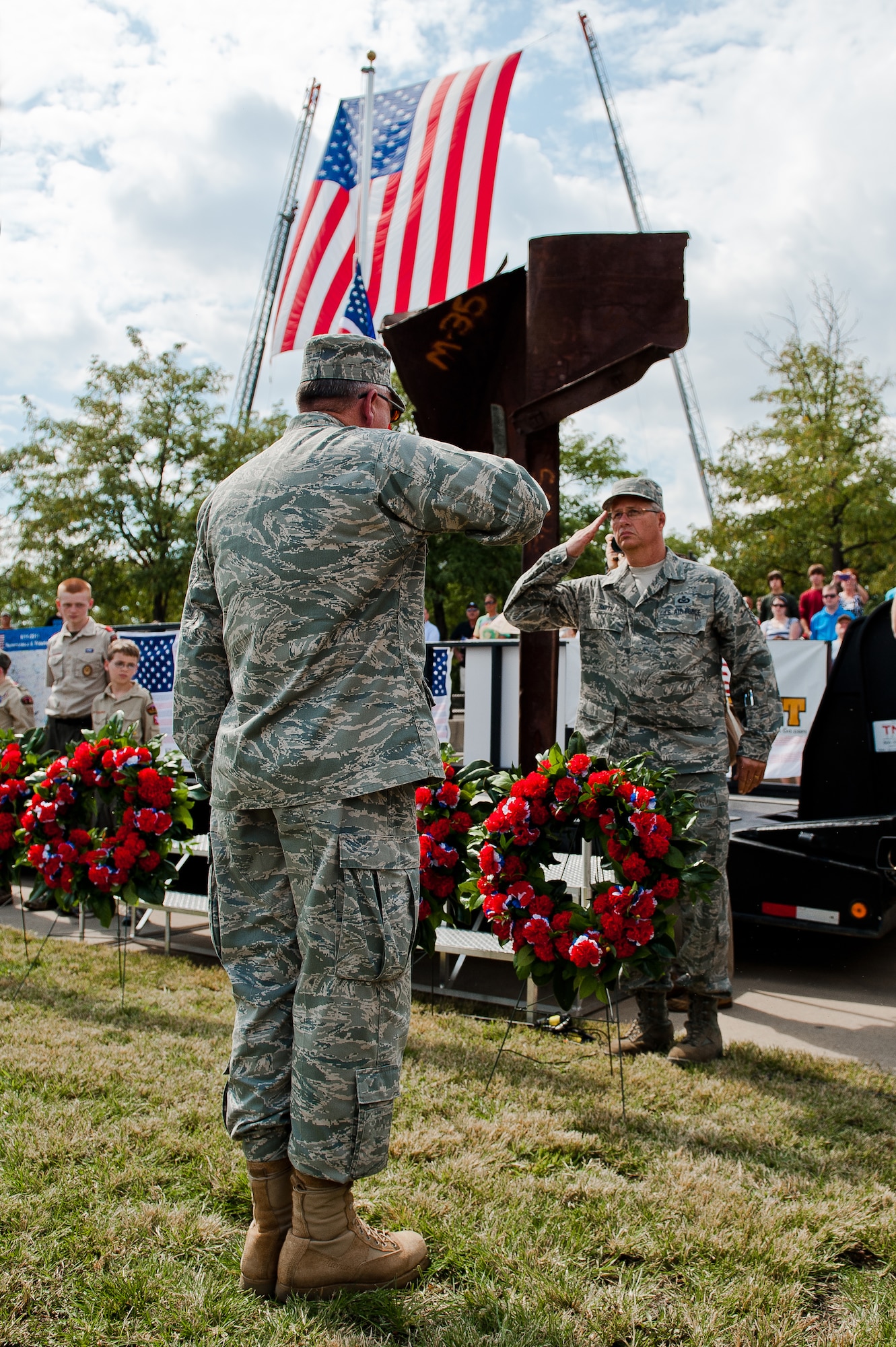 Brig. Gen. Michael Dornbush (left), chief of joint staff for the Kentucky National Guard's Joint Forces Headquarters, and Chief Master Sgt. James Smith, state command chief master sergeant (right), place a wreath in front of the 9/11 Memorial Sculpture at Waterfront Park in Louisville, Ky., Sept. 11, 2011, during city's 10th anniversary observance of the 9/11 terrorist attacks on the United States. The sculpture is made from steel taken from the wreckage of the World Trade Center. (U.S. Air Force photo by Maj. Dale Greer)