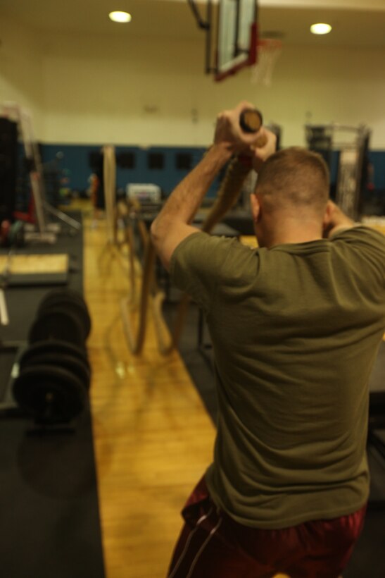 A service member uses thick heavy ropes to work out at the High Intensity Tactical Training Facility aboard Marine Corps Base Camp Lejeune, Feb. 1. The gym uses unconventional equipment not usually found in traditional gyms to get service members in shape and improve stamina.