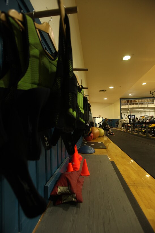 Weighted vests and sandbags line the walls at the High Intensity Tactical Training Gym aboard Marine Corps Base Camp Lejeune. The gym uses unconventional equipment, not usually found in traditional gyms, to get service members in shape and improve stamina.