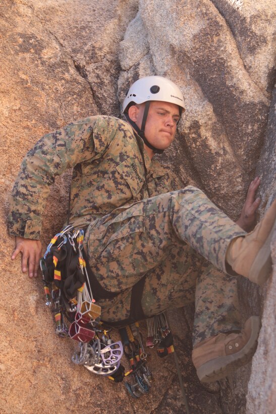 Lance Cpl. Corey Murphy, a rifleman with Company F, 2nd Battalion, 7th Marine Regiment, shimmies his way up a crevice in Joshua Tree National Park in Joshua Tree, Calif., Feb. 1, 2011. The Marines have been working with Special Operations Training Group assault climber instructors, from Marine Corps Base Camp Pendleton, Calif., in the park.