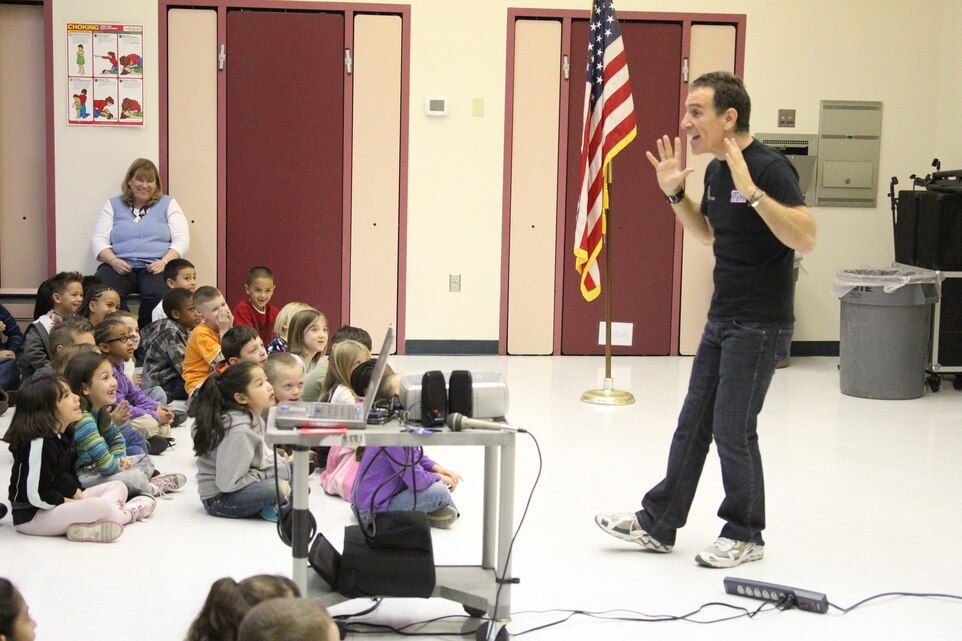 Trevor Romain, the founder of the Trevor Romain Co., uses body language to help tell his stories and jokes to the students of Condor Elementary during the ‘With You All the Way Tour’ assembly in the Condor cafeteria Feb. 1, 2011.