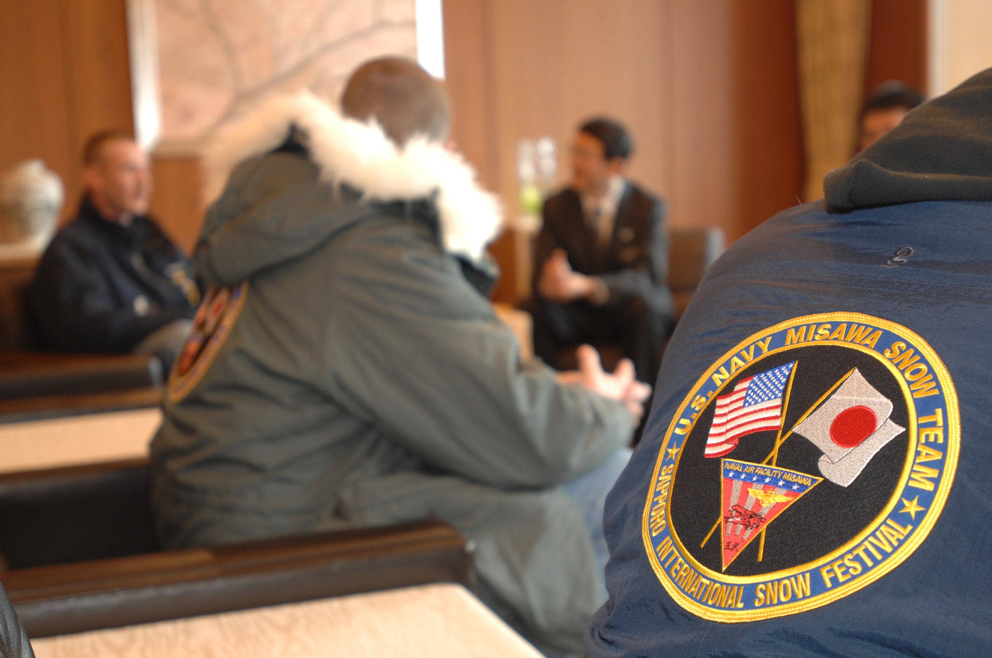 U.S. Navy Members of the Misawa Navy Snow Team attend an office call with the Sapporo Chief of Tourist Secretariat Jan. 31, 2011, Sapporo, Japan. The team is in the city to take part in the 62nd Annual Sapporo Snow Festival and will create a snow sculpture shaped like an anchor. This years marks the 28th year Naval Air Facility Misawa and its tenant commands have taken part in the northern-Japan located festival. (U.S. Navy photo by Chief Mass Communication Specialist Daniel Sanford/Released)