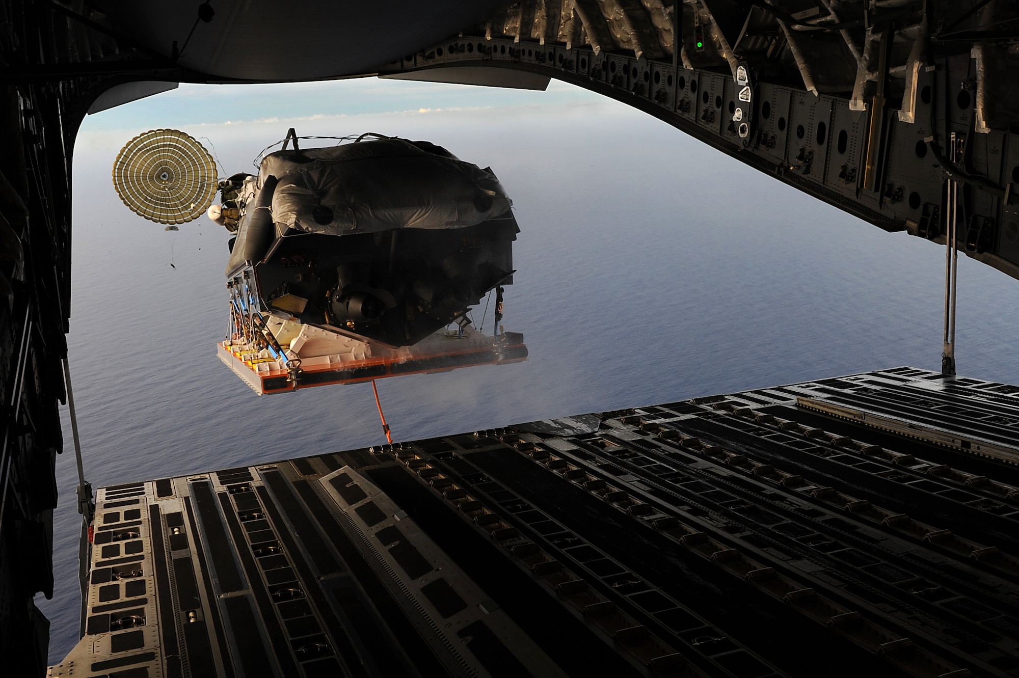 Hickam C 17 drops a Navy boat over Pacific 15th Wing Article