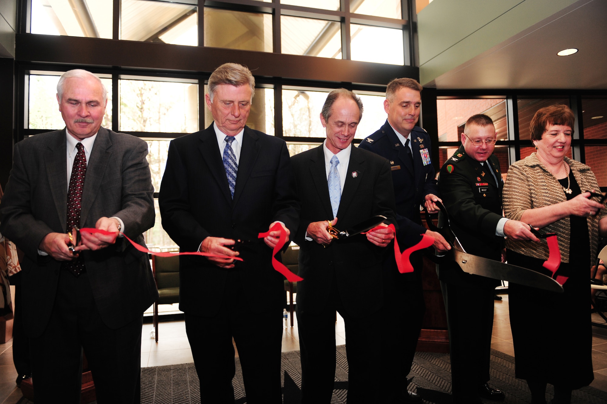 Tommy Swaim, former mayor of Jacksonville; Arkansas Governor Mike Beebe; Jacksonville Mayor Gary Fletcher; Col. Mike Minihan, 19th Airlift Wing commander; U.S. Army Col. Glen Masset, Army Corps of Engineer Little Rock district commander; and Melody Toney, 19th Force Support Squadron base education officer, cut the ribbon for the grand opening of the Jacksonville-Little Rock Air Force Base University Center Feb. 1, 2011, at Little Rock Air Force Base, Ark. The facility is the culmination of the city of Jacksonville’s hard work, the efforts of government and community leaders, and the U.S. Air Force’s need for a modern facility. (Photo by U.S. Air Force Senior Airman Jim Araos)