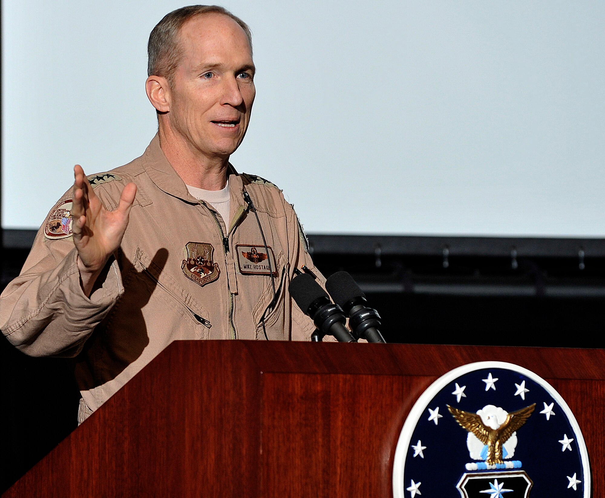 Air Forces Central Commander Lt. Gen. Mike Hostage speaks with Air Force Academy cadets in the Arnold Hall Theater Jan. 25, 2011. During his visit to the Academy, General Hostage showcased how lieutenants are contributing to allied efforts in Afghanistan and Iraq and stressed the importance of a disciplined, professional corps of aviators. (U.S. Air Force photo/Bill Evans)