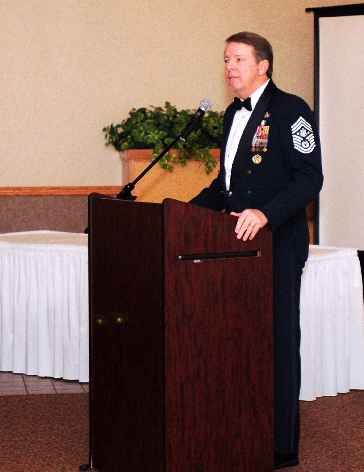 Retired Chief Master Sergeant of the Air Force Rodney J. McKinley speaks to attendees at the Chief Master Sergeant Induction Ceremony Jan. 26, 2011, Eielson Air Force Base. The chiefs were honored that night for their selection to the highest enlisted rank. (U.S. photo by/Airman 1st Class Laura Goodgame)