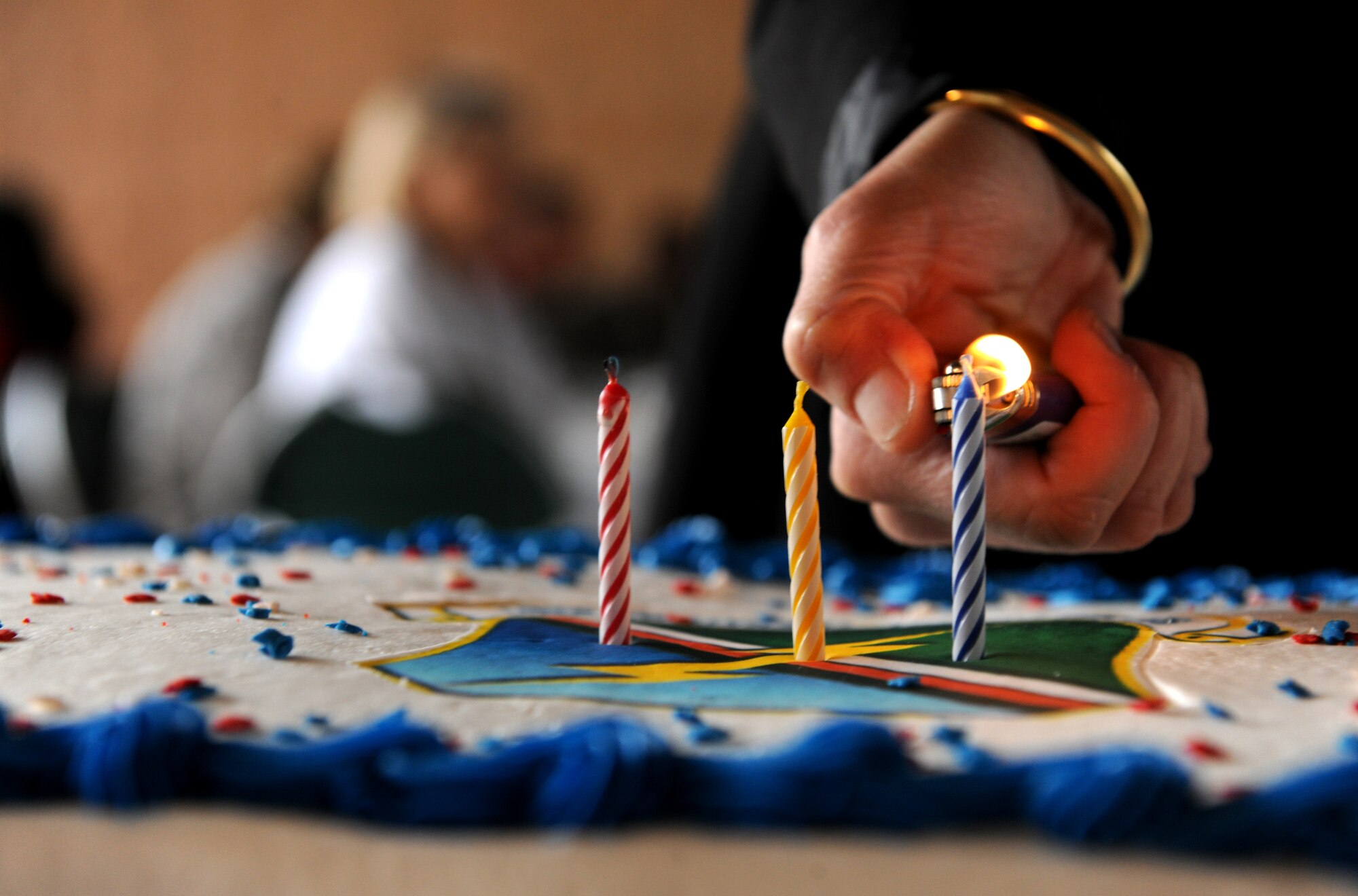 MOODY AIR FORCE BASE, Ga.-- Three candles are lit during the 93rd Air Ground Operations Wing birthday celebration Feb. 1. The candles represent the number of years the 93rd AGOW has been active at Moody. (U.S. Air Force photo/Airman 1st Class Benjamin Wiseman)(RELEASED)