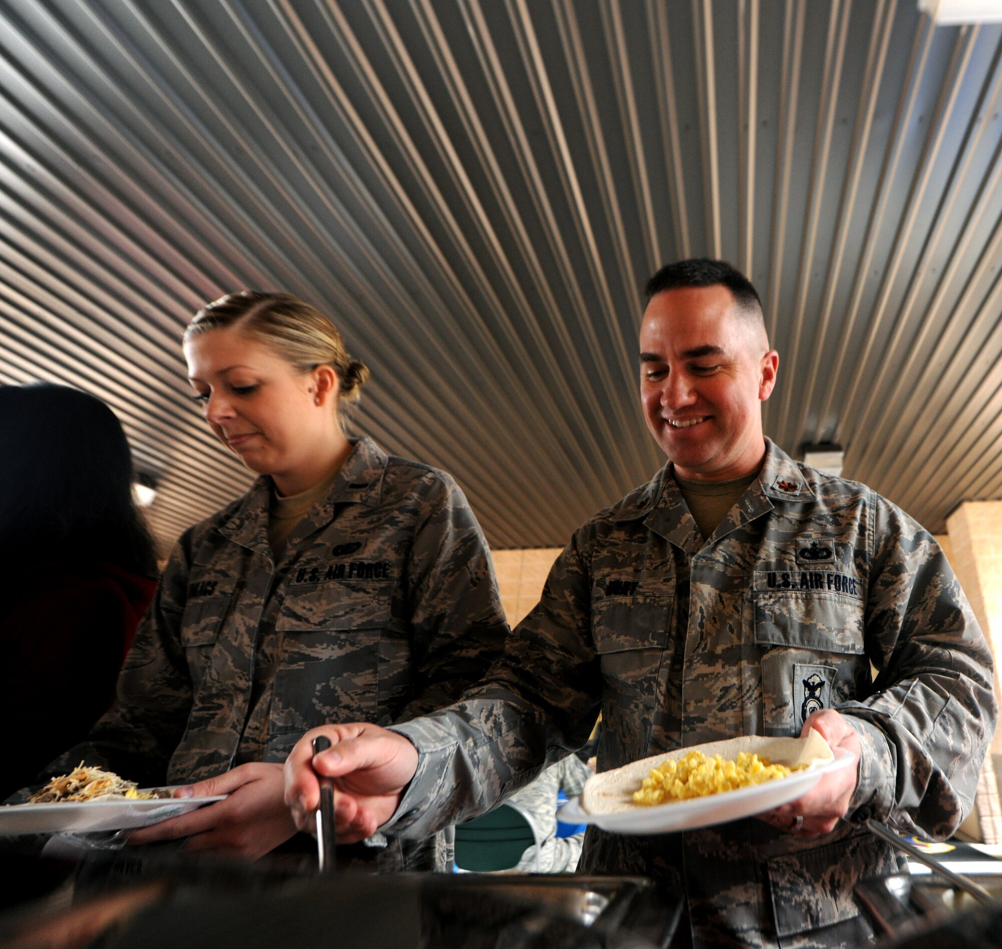 MOODY AIR FORCE BASE, Ga.-- Maj. Rusty Hunt, 93rd Air Ground Operations Wing director of operations, makes a breakfast burrito during the 93rd AGOW birthday celebration Feb. 1. Since being activated in 2008, the wing has conducted combat operations in Operations Enduring Freedom, Iraqi Freedom and New Dawn. (U.S. Air Force photo/Airman 1st Class Benjamin Wiseman)(RELEASED