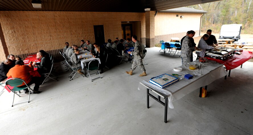 MOODY AIR FORCE BASE, Ga.-- Members of the 93rd Air Ground Operations Wing enjoy breakfast during the 93rd AGOW’s third birthday celebration Feb. 1. The 93rd AGOW was originally activated in 1942 as the 93rd Bomb Group and participated in the first low-level attack of B-24 Liberator heavy bomber aircraft on oil installations in Romania during World War II. (U.S. Air Force photo/Airman 1st Class Benjamin Wiseman)(RELEASED)