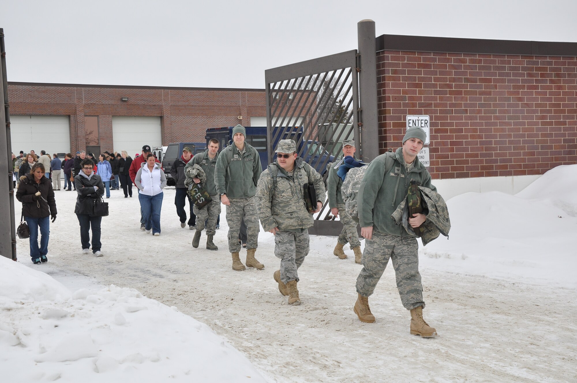 934th Civil Engineers head for the bus  to Ft. McCoy Jan. 29 for combat skills training before leaving for Afghanistan. (Air Force Photo/Tech. Sgt. Bob Sommer) 