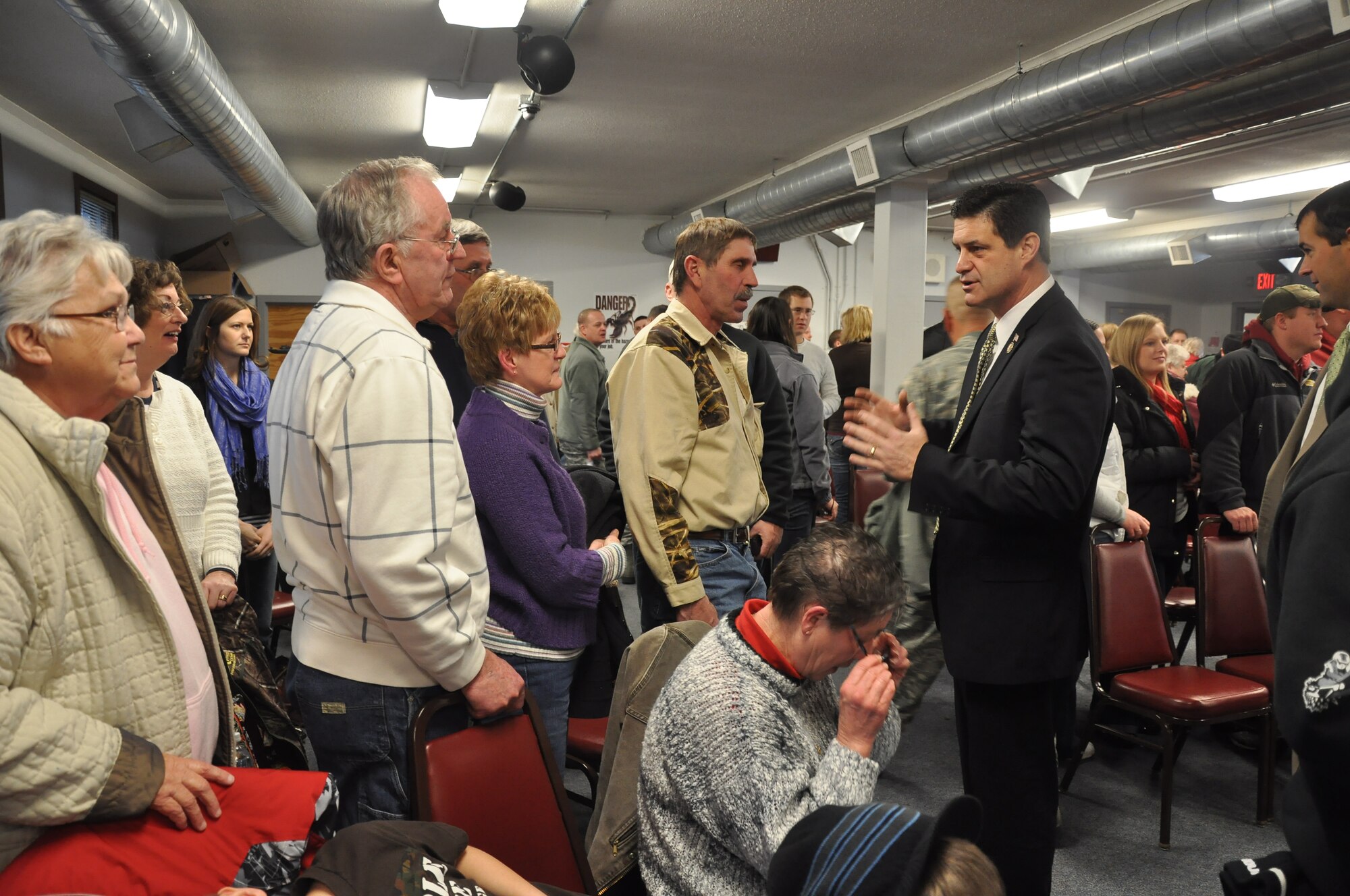 Congressman Chip Cravaack talks with 934th Civil Engineers and their families at a deployment ceremony Jan. 29.  The CE members left for Ft. McCoy for combat skills training before leaving for Afghanistan. (Air Force Photo/Tech. Sgt. Bob Sommer) 