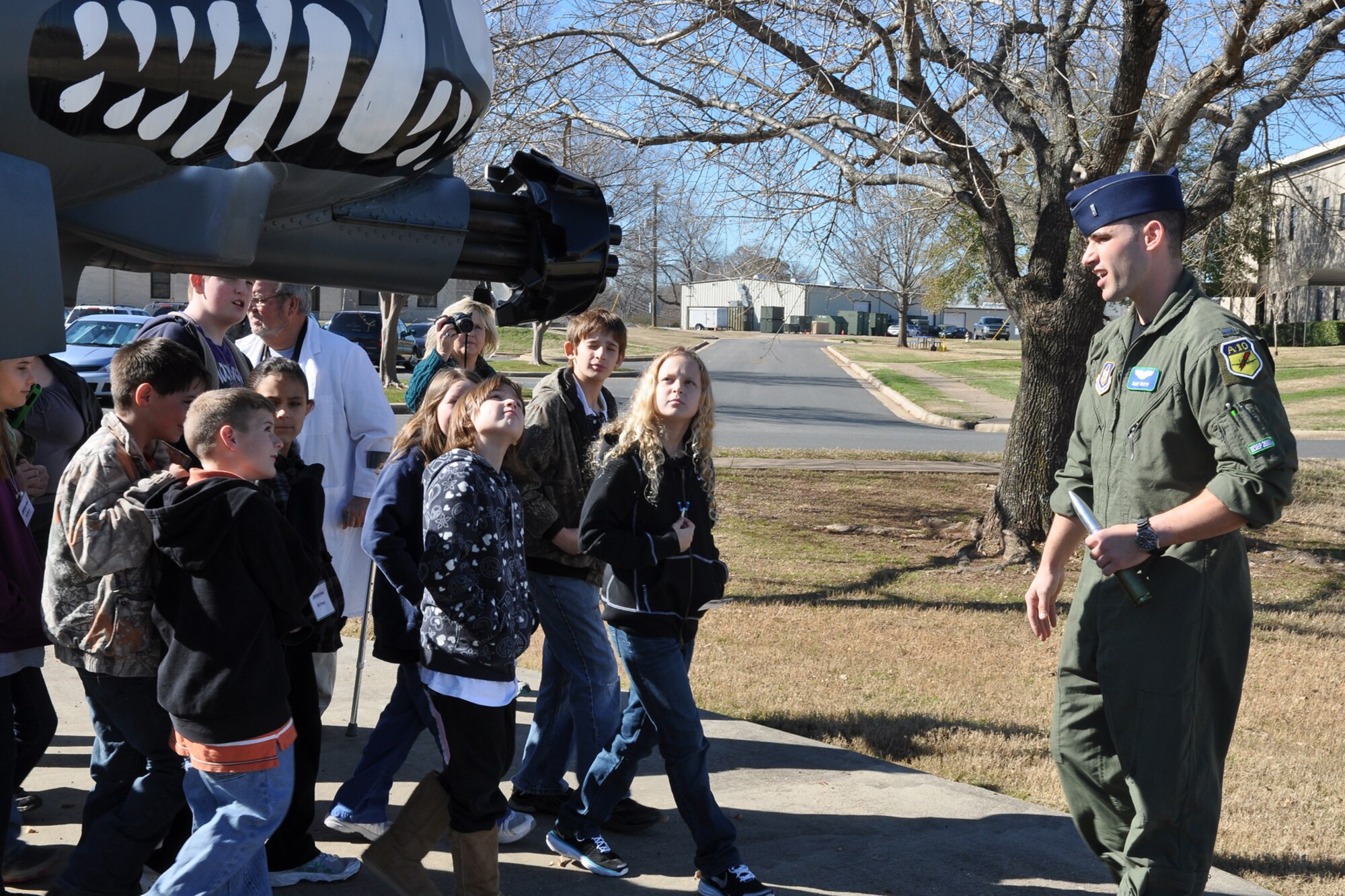1st Lt. Taylor G. Petty, student pilot, 47th Fighter Squadron, explains the camera capabilities of the B-52 Startofortress to a group of 5th graders from Mooringsport Elementary School during a tour of an A-10 Thunderbolt II static display at Barksdale Air Force Base, La., Jan. 28, 2011. The Mooringsport students are attending STARBASE Louisiana, at Barksdale, one of 60 national STARBASE sites. It is sponsored by the 307th Bomb Wing of the Air Force Reserve Command. The program presents an exciting 25-hour hands on/minds on aviation and aerospace curriculum to area 5th grade students and their teachers. The DoD program is committed to addressing the critical needs in STEM education - Science, Technology, Engineering and Mathematics - STARBASE Louisiana introduces its students to exciting STEM education topics, inspiring these young minds to further explore these topics in future course work. Mooringsport Elementary is part of the Caddo Parish School System. (U.S. Air Force photo/Betty Stephens)