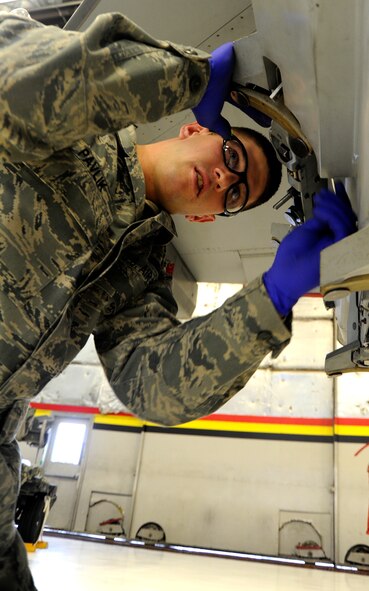 U.S Air Force Senior Airman Ryan Pavlik, 388th Aircraft Maintenance Squadron, prepares the F-16 Fighter Falcon for the Load Crew of the Year (LCOY) competition on Dec.17, 2010 on Hill Air Force Base, Utah. LCOY gives three maintenance squadrons on Hill AFB a chance to showcase their efficiency against each other while being judged for accuracy and speed.(U.S. Air Force photo by Airman Allen Stokes)