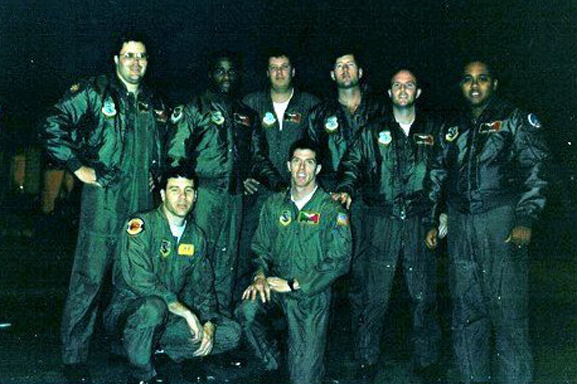 Aircrew members gather for a photo at Barksdale Air Force Base, La., before the mission that will fire the opening shots of OPERATION DESSERT STORM, Jan. 16, 1991. Standing - Capt. Scott Ladner, radar navigator, 596th Bomb Squadron, 1st Lt. Michael Branche - co-pilot 596th BS, Senior Airman Guy Modgling, gunner, 596th BS, Capt. Steve Bass, pilot, 596th BS, Capt. Bernie Morgan, pilot, 596th BS, and 1st Lt. Andre Mouton, navigator, 596th BS. Kneeling - Maj. Wes Bain, radar navigator, 49th Test Squadron, and Capt. Trey Morriss, electronic warfare officer, 596th BS. Some of the Airmen who participated in the historic mission gathered recently in Bossier City, La., to commemorate the event. (Courtesy photo)

