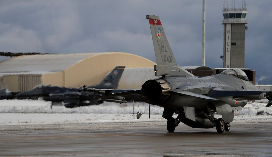Two F-16 Fight Falcons taxi down the runway prior to take off on Hill Air Force Base Dec. 16 2010. Hill Air Force performs multiple launches a day to insure each jet is fully functional and mission ready.(U.S. Air Force photo/Senior Airman Devin Doskey)
