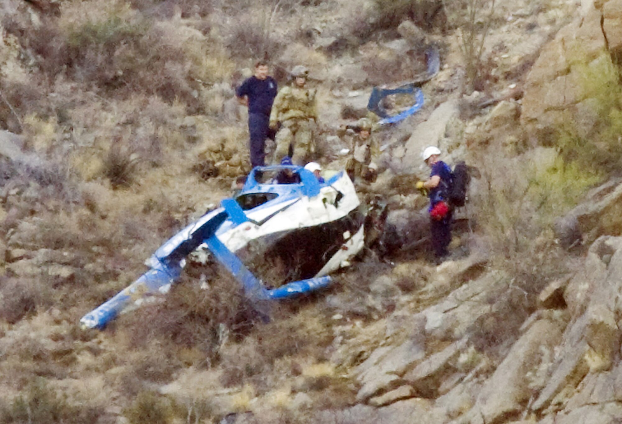 DAVIS-MONTHAN AIR FORCE BASE, Ariz. - Air Force Reserve combat rescue officers and pararescuemen from the 943rd Rescue Group here, responded to an Arizona Sheriff's helicopter crash in the Waterman mountains, northwest of Tuscon. The Airmen used their combat rescue skills to provide medical aid to the surivors who were then airlifted by Airmen piloting two HH-60G Pave Hawk helicopters from the 943rd RQG. They airlifted the survivors to a nearby hospital. The crash killed one and injured three others. (Arizona Daily Star photo/Mr. Dean Knuth)