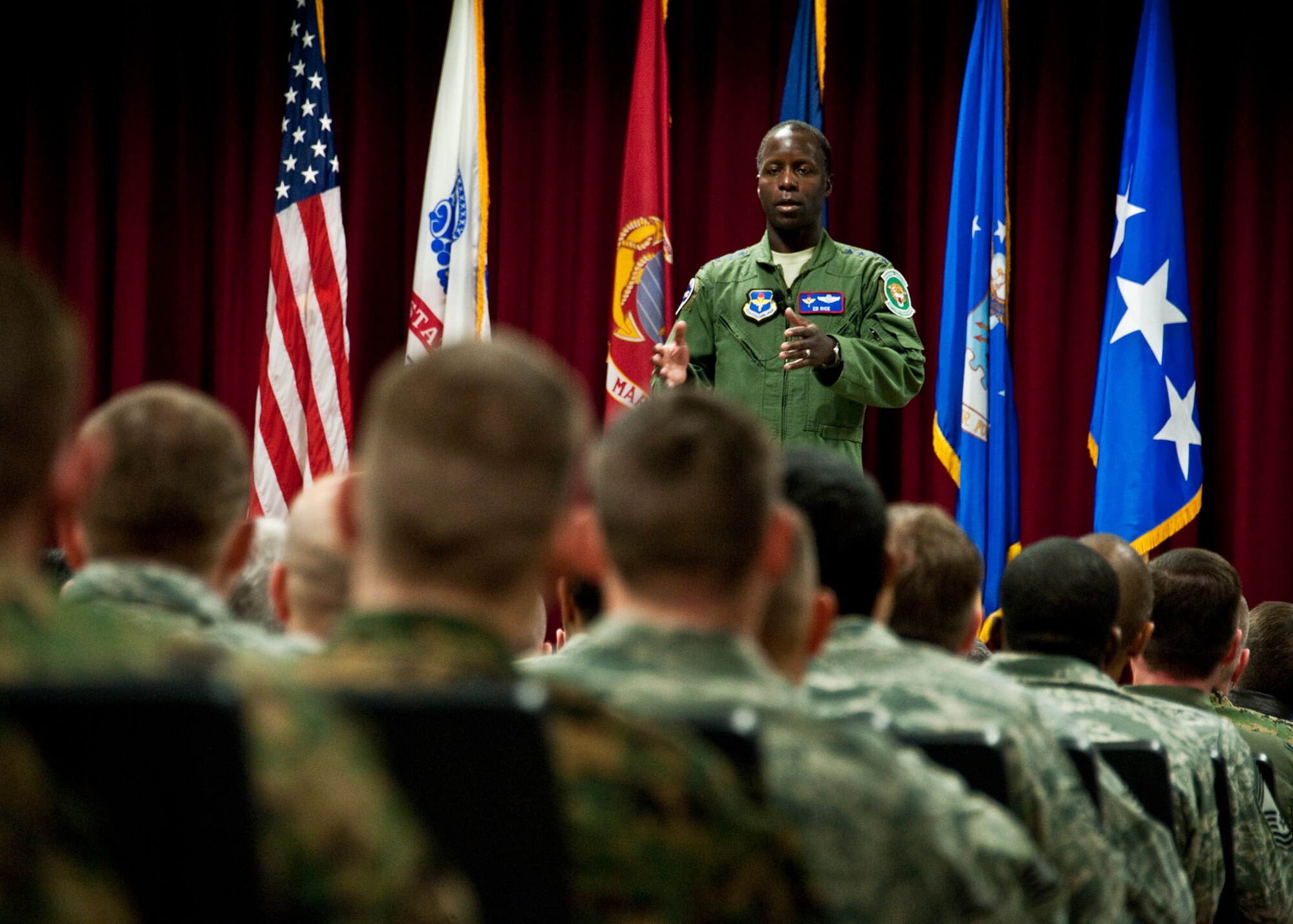 EGLIN AIR FORCE BASE, Fla. - Gen. Edward Rice speaks at an all-hands call during his first visit the 33rd Fighter Wing to connect with the new unit at the beginning of his leadership of Air Education and Training Command. The general spoke about the commands relationship with the wing's unique joint training center that could be a template for future endeavors. They will train F-35 pilots and maintainers for the Air Force, Navy and Marines. (2nd Lt. Andrew Caulk/U.S. Air Force photo)