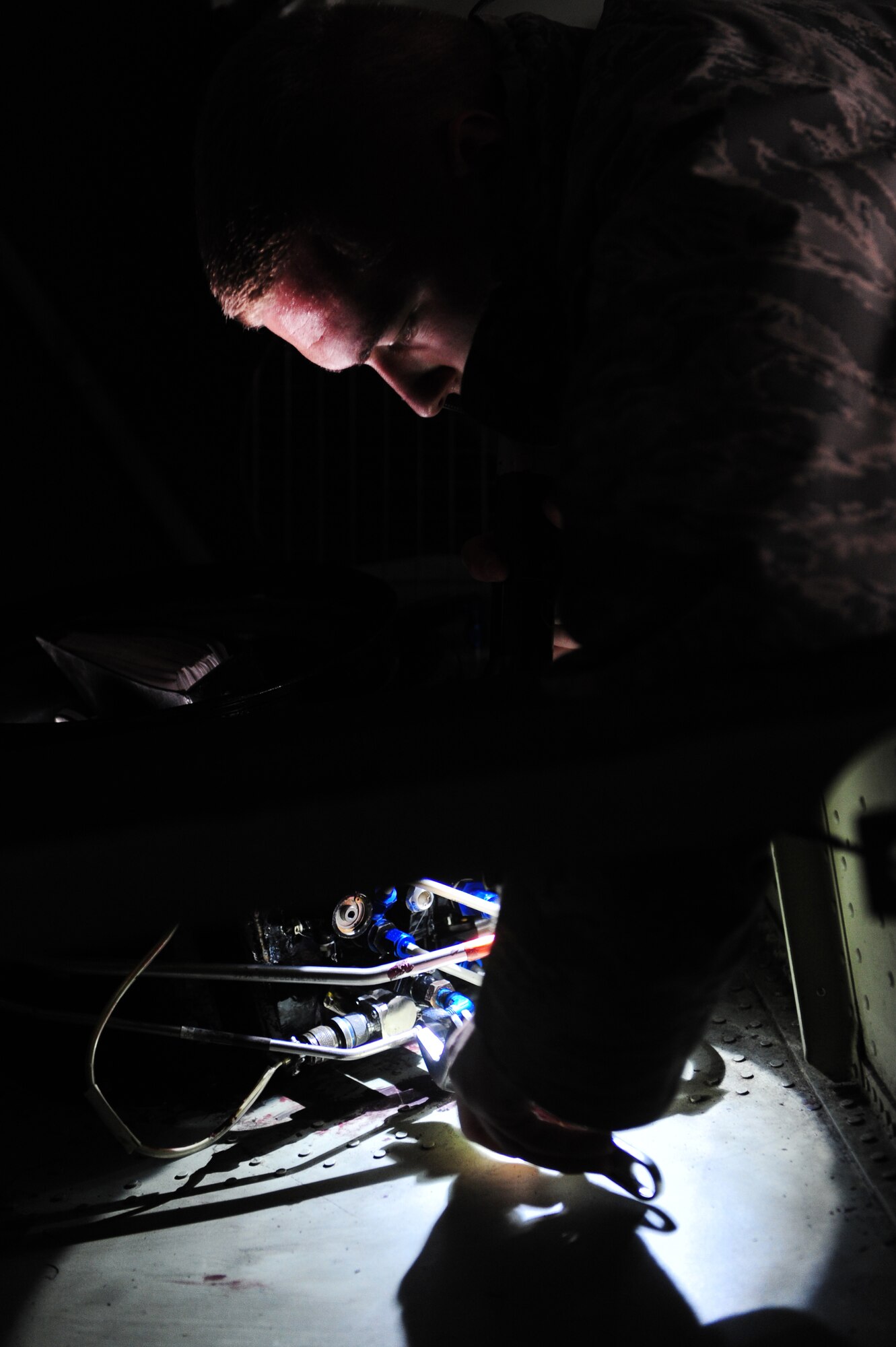 Senior Airman Matthew Lampman, a 314th Aircraft Maintenance Squadron electrical and environmental systems journeyman, replaces a pressurization safety valve during a unit compliance inspection Jan. 26, 2011, at Little Rock Air Force Base, Ark.  C-130J’s can’t fly without a pressurization safety valve to regulate the cabin pressure. (Photo by U.S. Air Force Senior Airman Jim Araos)