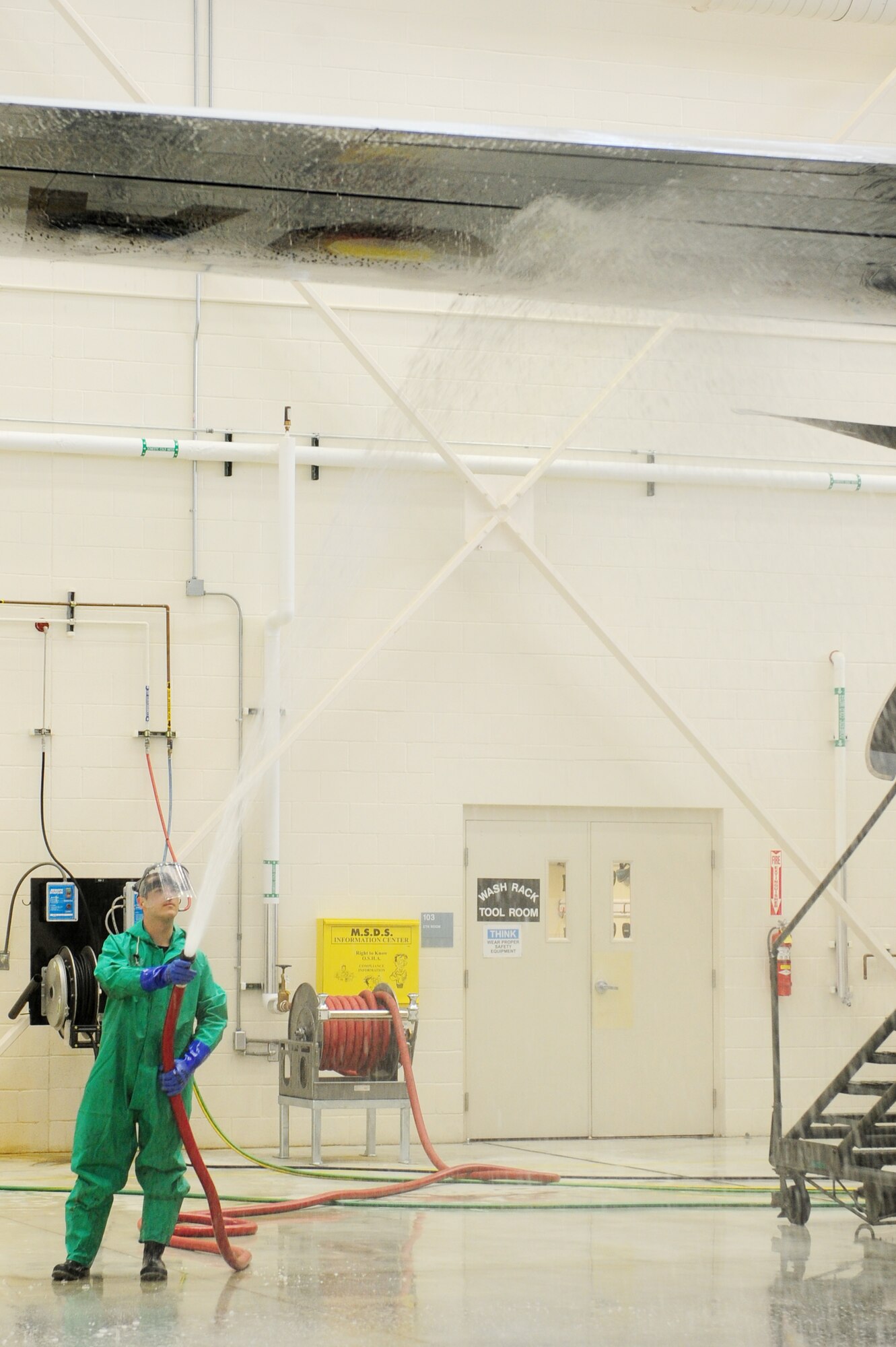 Senior Airman Daniel Baker, a 314th Aircraft Maintenance Squadron hydraulics craftsman, washes the wing of a C-130J Jan. 26, 2011, at Little Rock Air Force Base, Ark. Each C-130 is washed once every 150 days.  (Photo by U.S. Air Force Senior Airman Jim Araos)