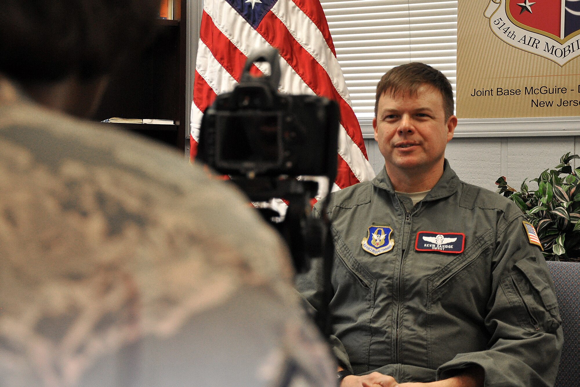 Senior Master Sgt. Kevin Savidge, 514th Aerial Evacuation Squadron, responds to interview questions posed by Master Sgt. Donna Jeffries, 514th Air Mobility Wing public affairs, here Jan. 26. 2011. The video footage from the interview will be included in a presentation highlighting the Air Force's professional nursing corp. Sergeant Savidge, a Reserve Airman, explained how he leveraged his civilian work experience during his recent deployment to Afghanistan. Helicopter-based medical evacuation is not normally performed by Ai r Force personnel, but Sergeant Savidge? employment as a helicopter paramedic for a Philadelphia hospital made him uniquely qualified to help alleviate some of the demand for helicopter flight nurses within Air Force Central Command. Flying primarily on the HH-60G Pave Hawk helicopter, Sergeant Savidge participated in 75 combat rescue missions which resulted in more than 90 lives saved.  Approximately 40 percent of his patients were Afghani civilians and servicemembers. (U.S. Air Force photo/Tech. Sgt. Shawn J. Jones)