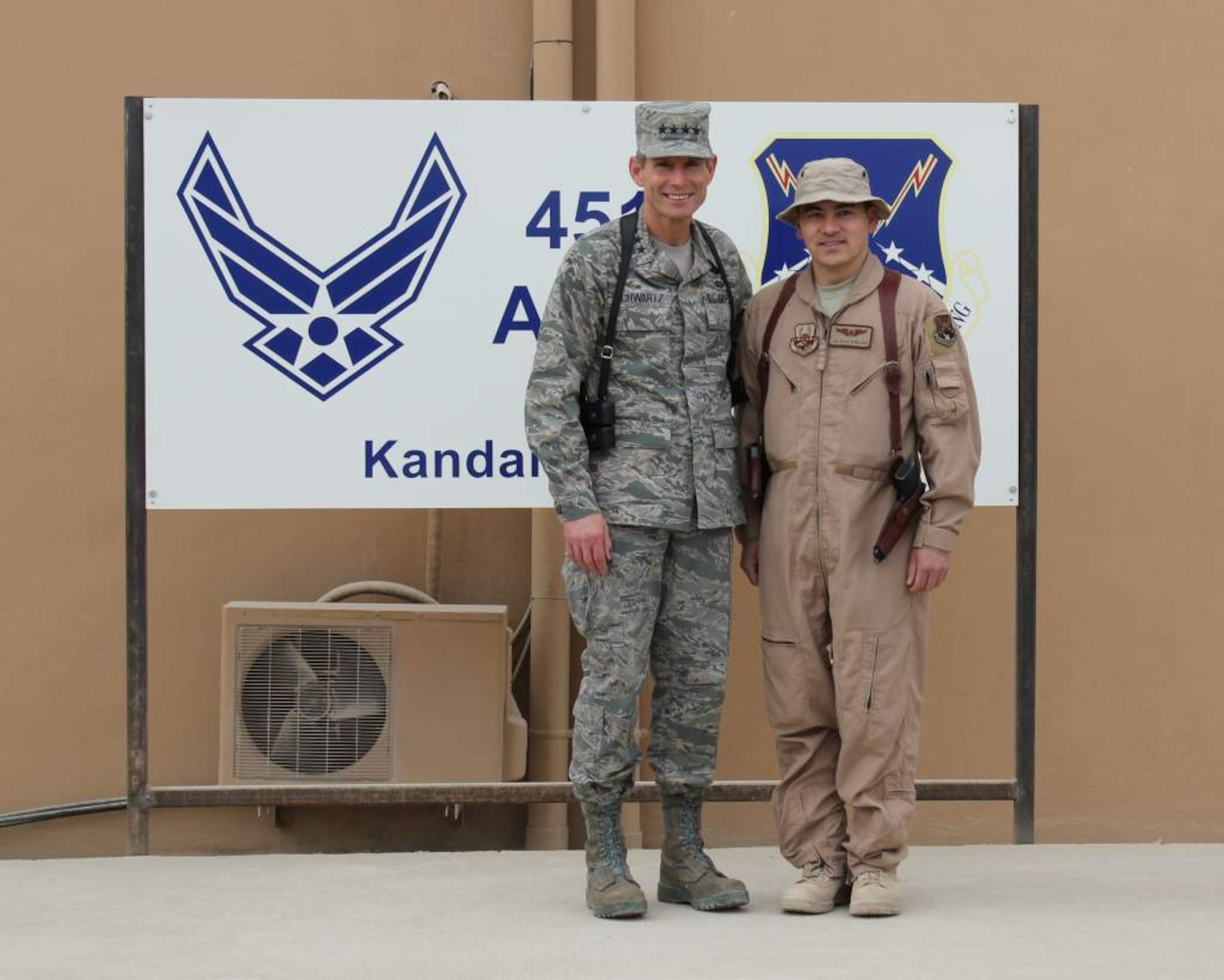 KANDAHAR AIR BASE, Afghanistan--  Gen. Norton Schwartz, Chief of Staff of the Air Force,  meets with Senior Airman Micah Nomiyama, 361 Expeditionary Reconnaissance Squadron, Jan. 19 during a visit to the base. Airman Nomiyama graduated from the Chinese Language course at the Defense Language Institute at the Presidio of Monterey, Calif. in 2009. (courtesy photo)