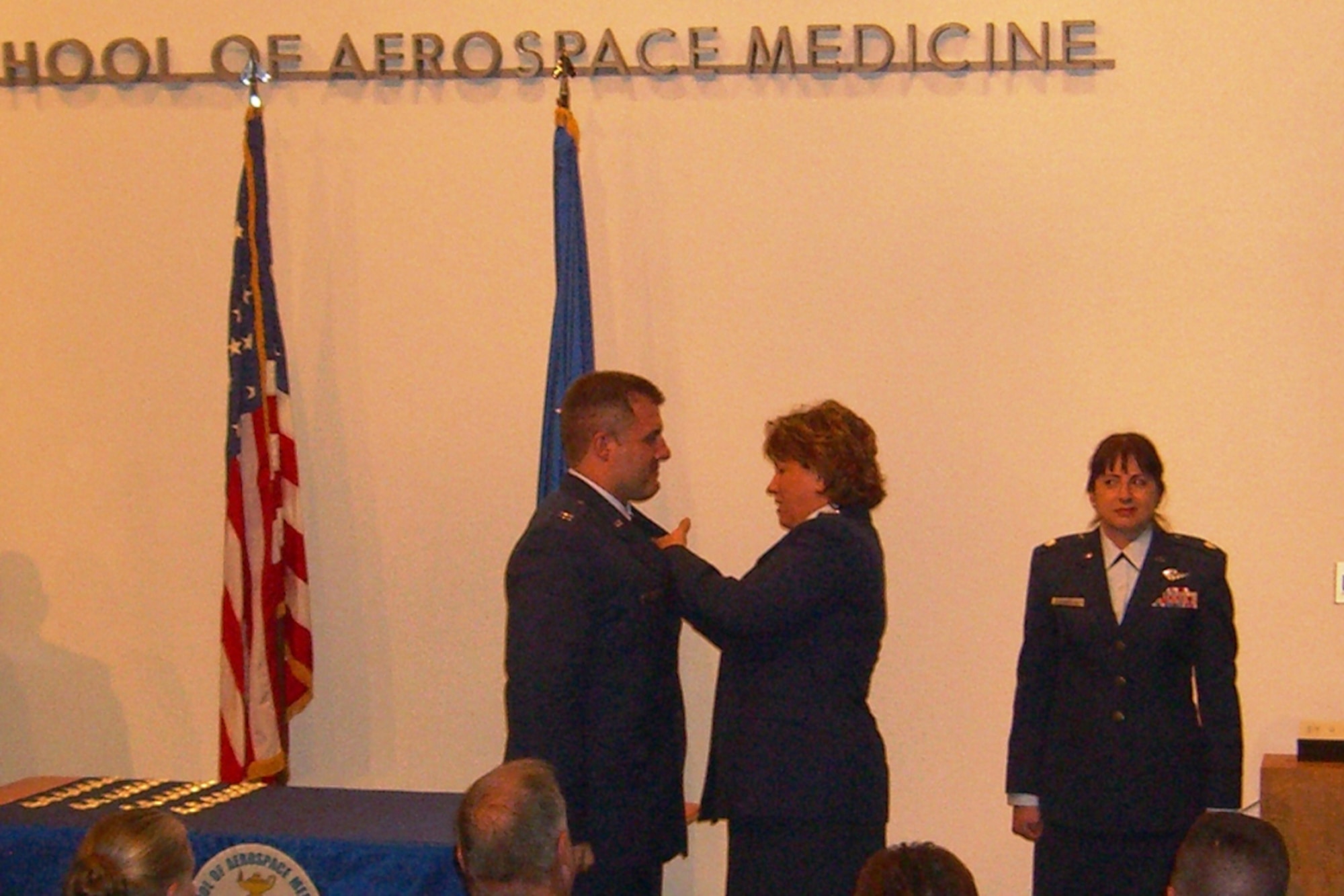 More than 300 guests filled the auditorium at The USAF School of Aerospace Medicine as the final class of students at Brooks City-Base in San Antonio, TX, graduated on Jan. 29. Each of the Aeromedical Evacuation crew members received their “wings”, the uniform emblem that identifies them as a member of the elite Flight Nurse and Aeromedical Evacuation team.  As the wings were pinned on, many times by a family member or a superior officer, each recipient’s pride was obvious. Among the attendees gathered to witness the historic event were the families of the graduating class, flight nurses from around the world, past instructors, USAFSAM alumni, and local community guests.  The school is in the process of relocating to a new state-of-the-art facility at Wright-Patterson AFB, Ohio, under the 2005 Base Realignment and Closure initiative. Photo By: Mary Kay Stewart
