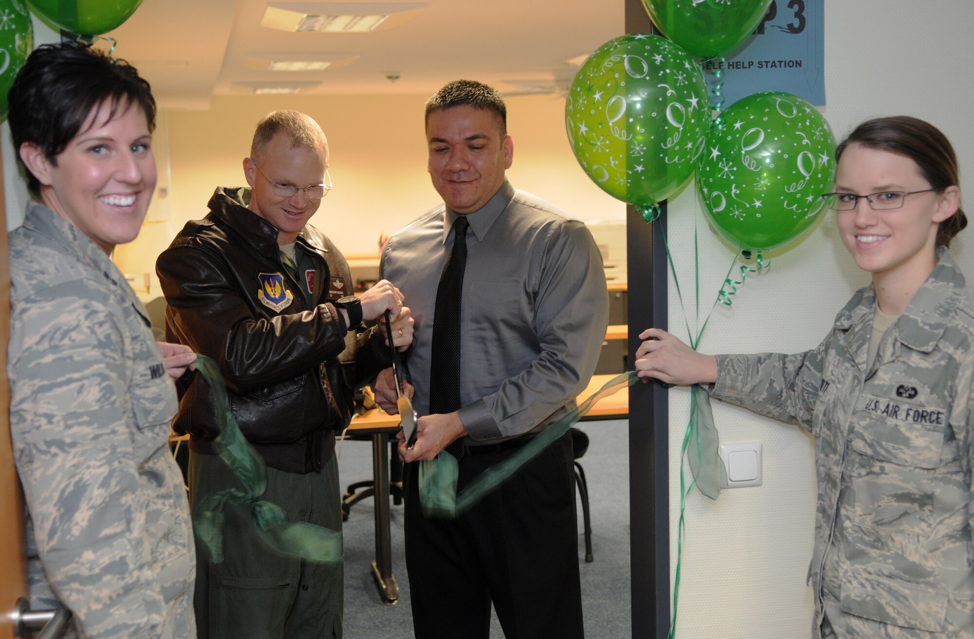 SPANGDAHLEM AIR BASE, Germany – Col. Christopher Weggeman, 52nd Fighter Wing commander, and Juan Carrizales, Internal Revenue Service senior tax consultant from San Antonio, Texas, cut the 52nd FW Tax Center ribbon held by Capt. Emily Wilson, 52nd FW Judge Advocate chief of civil law, and Airman 1st Class Emilymae Beckett, 52nd FW JA claims paralegal, to mark its opening Jan. 28. The 52nd FW Tax Center will be open Feb. 1 – June 15 and is located on the first floor of Bldg. 125. (U.S. Air Force photo/Airman 1st Class Matthew B. Fredericks)