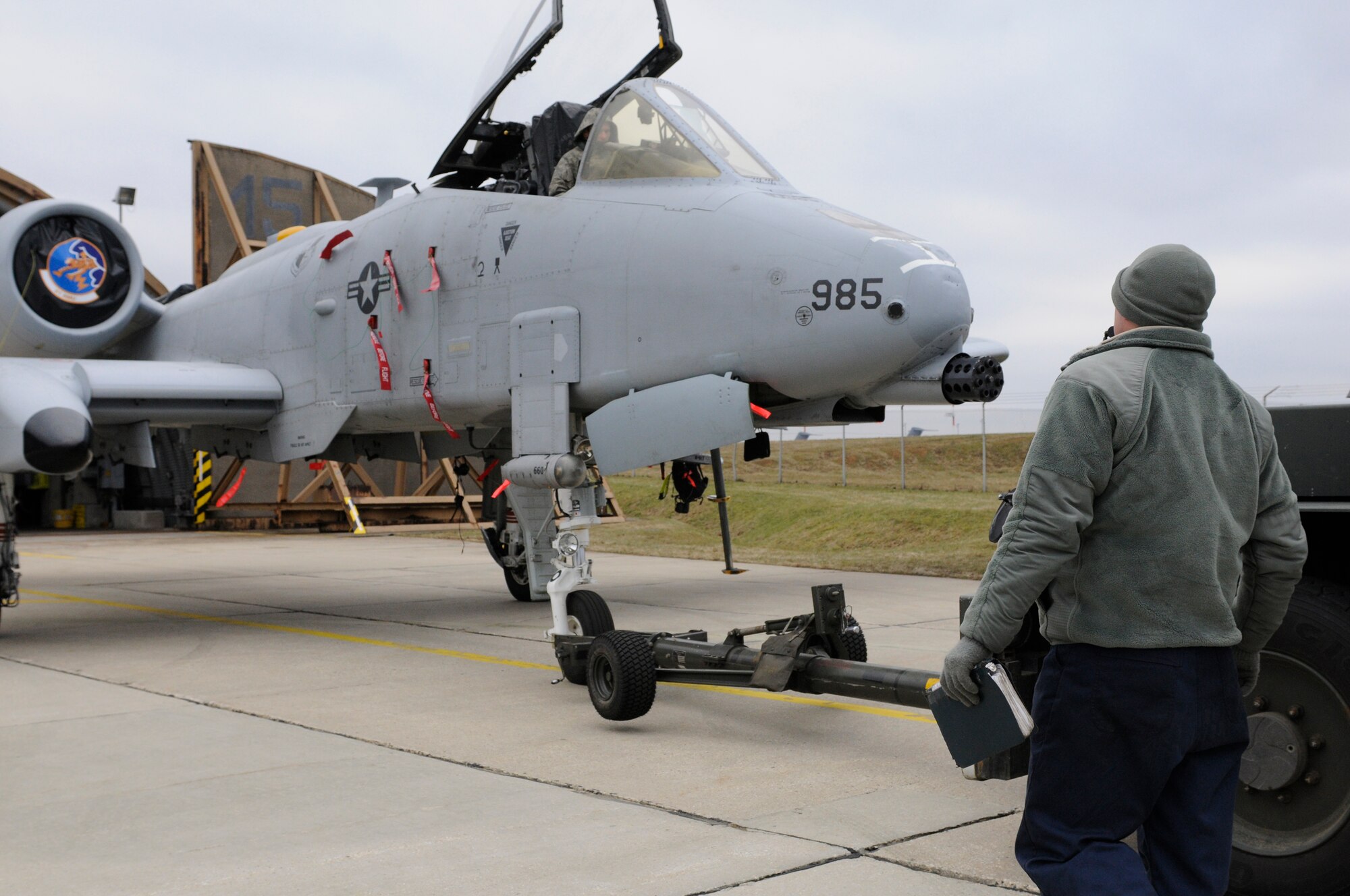 SPANGDAHLEM AIR BASE, Germany – Airmen from the 81st Fighter Squadron back an A-10 Thunderbolt II into a hardened aircraft shelter Jan. 28. Staff Sgt. Jesse Williams, dedicated crew chief, right, was awarded the Chief Master Sgt. Thomas N. Barnes Award at the U.S. Air Forces in Europe level. This award recognizes the most outstanding crew chief in the major command. (U.S. Air Force photo/Senior Airman Clay Murray)