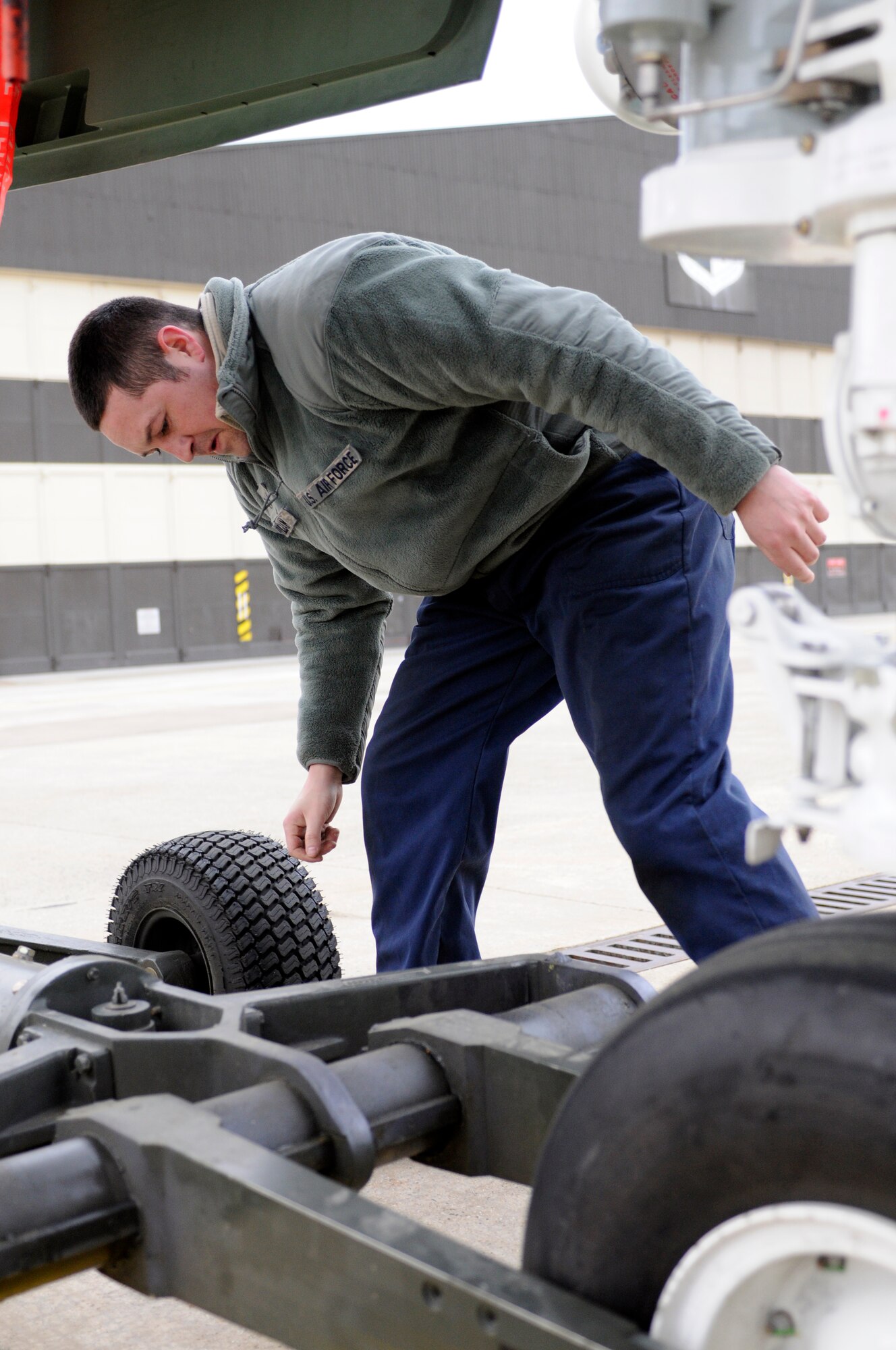 SPANGDAHLEM AIR BASE, Germany – Staff Sgt. Jesse Williams, 81st Fighter Squadron dedicated crew chief, inspects a tow hook before helping Airmen from his aircraft maintenance unit transport an A-10 Thunderbolt II to a hardened aircraft shelter Jan. 28. Sergeant Williams was awarded the Chief Master Sgt. Thomas N. Barnes Award at the U.S. Air Forces in Europe level. This award recognizes the most outstanding crew chief in the major command. (U.S. Air Force photo/Senior Airman Clay Murray)